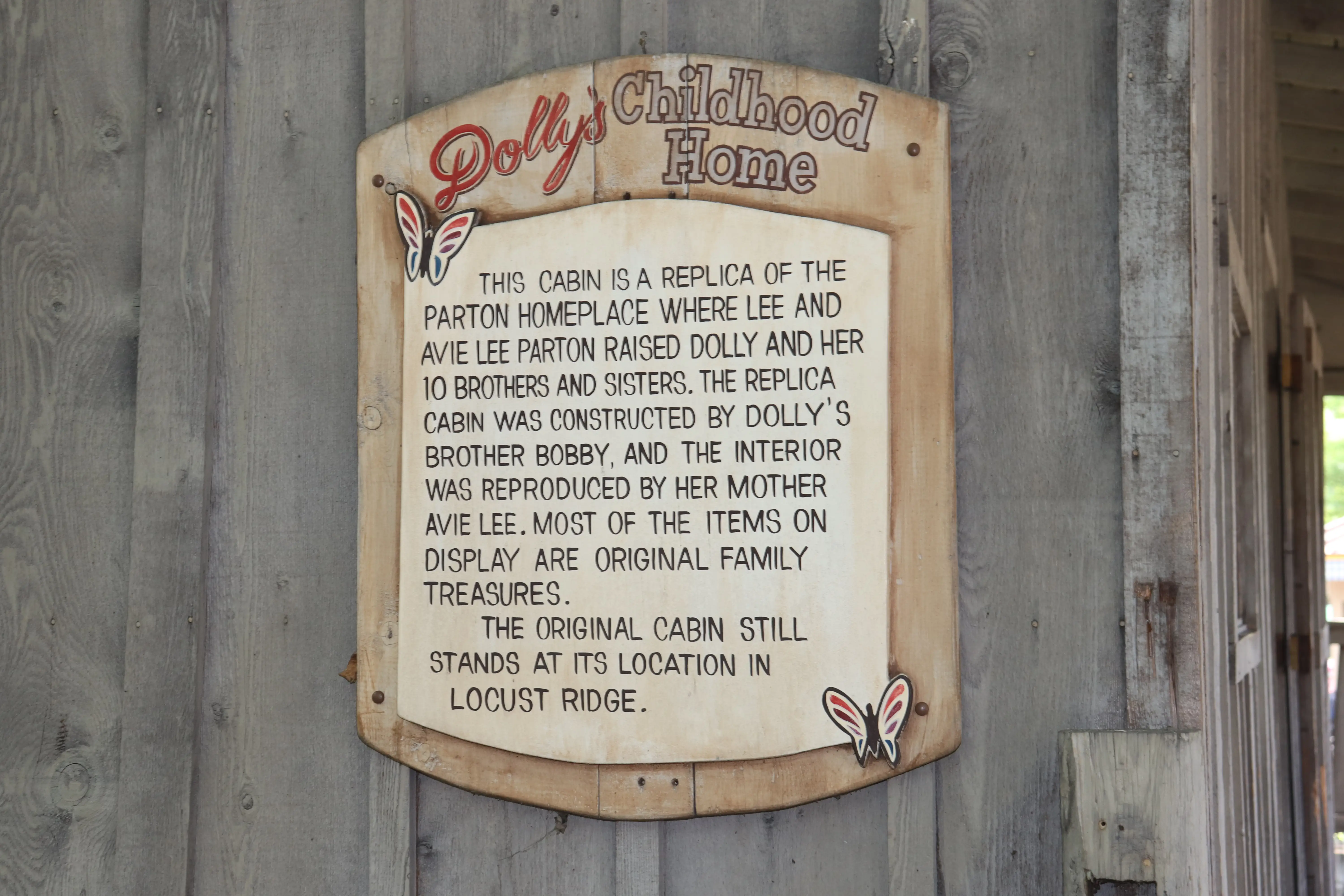 A sign outside Dolly Parton's childhood home at Dollywood.
