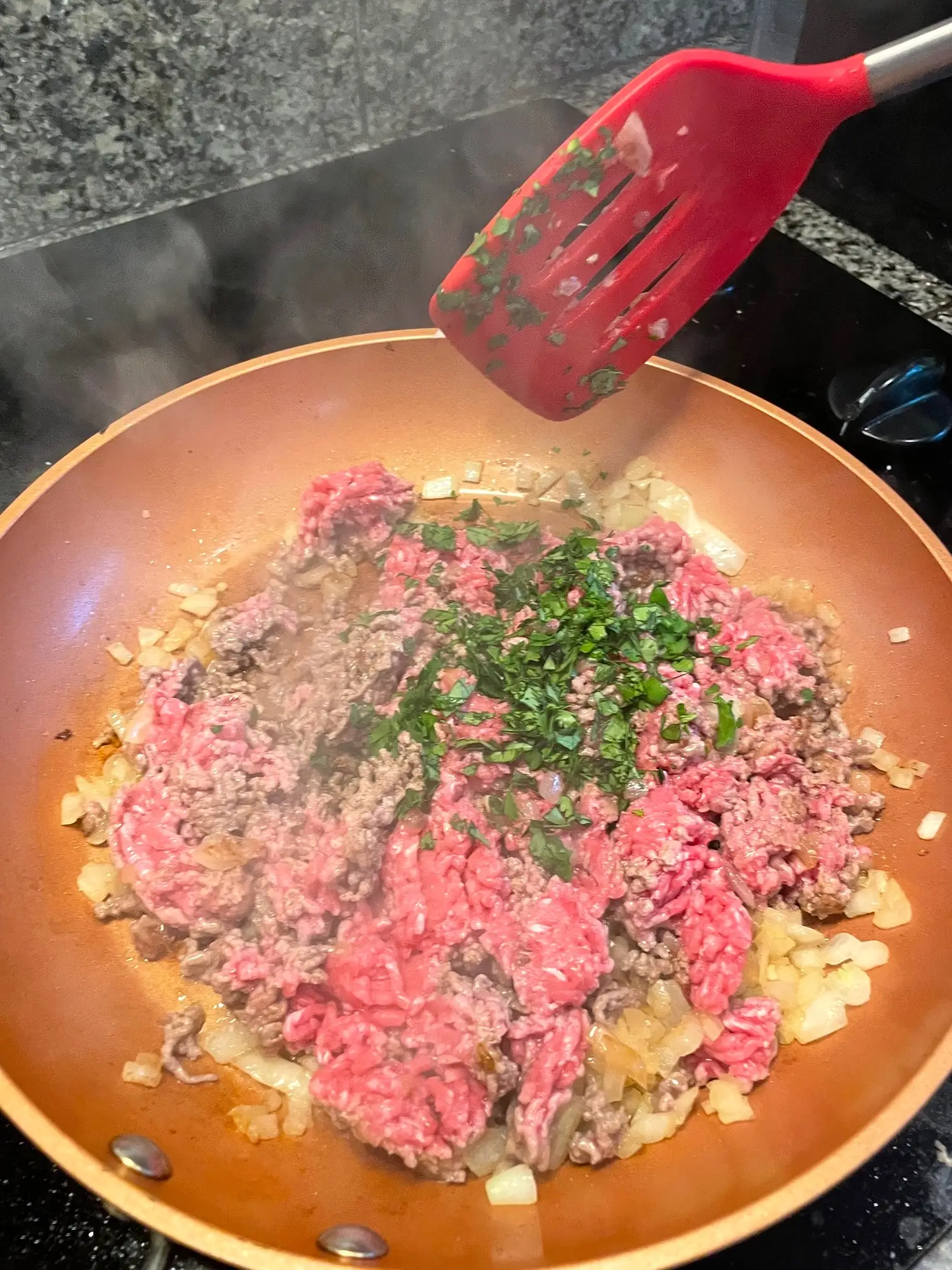 Adding parsley for yemista