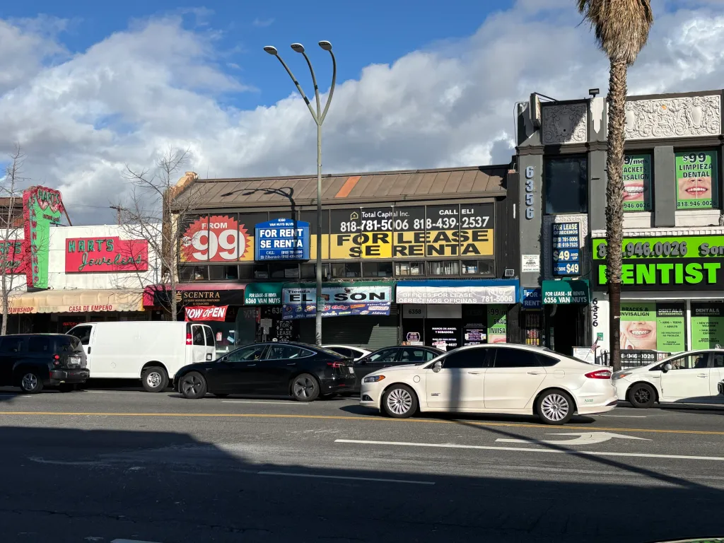 A street scene on Van Nuys Boulevard with several storefronts, 