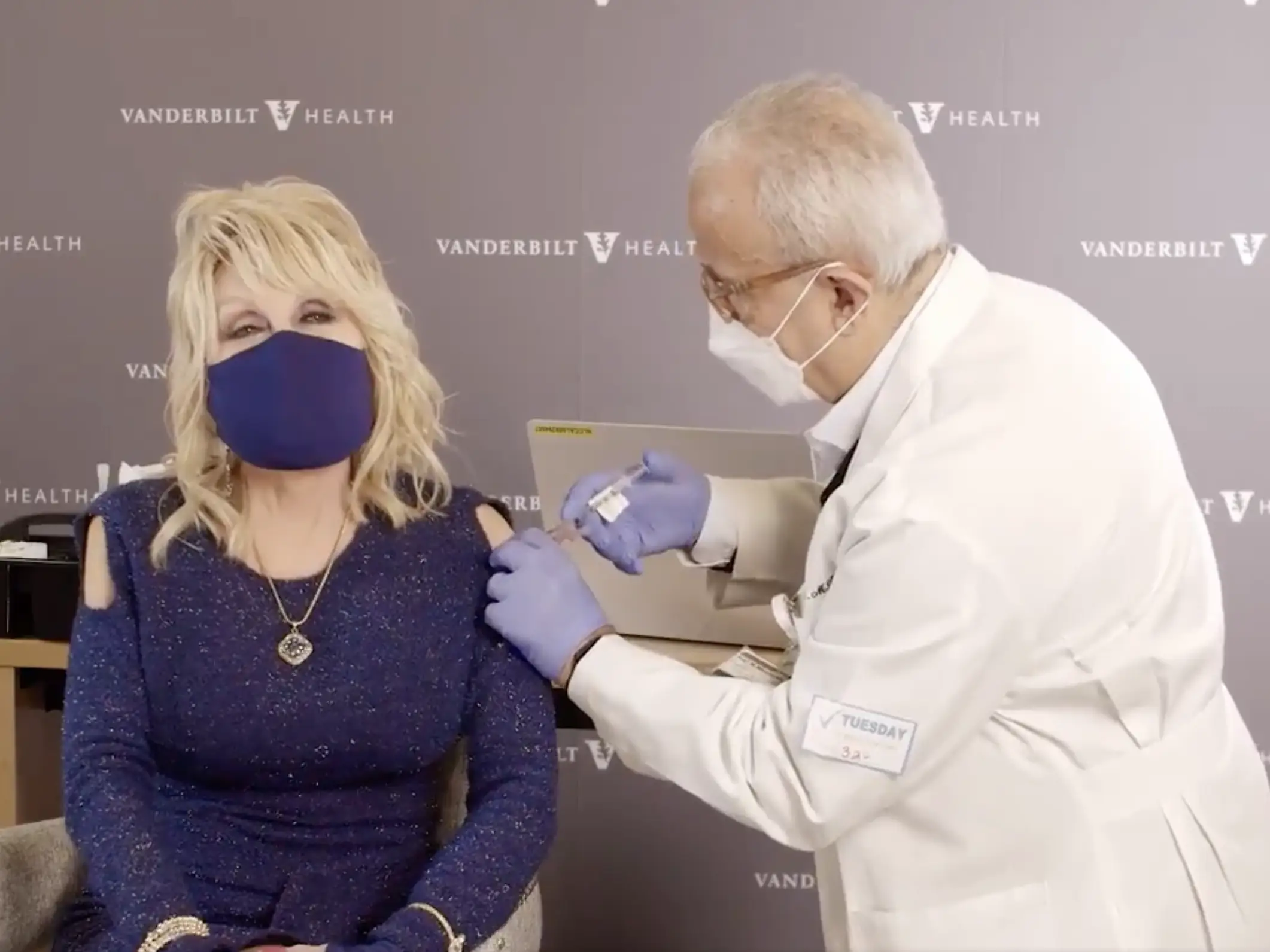 Dolly Parton receives the COVID vaccine.