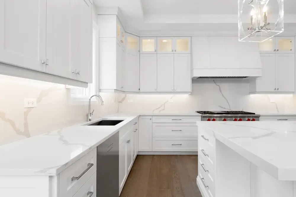 all white kitchen with wood floor