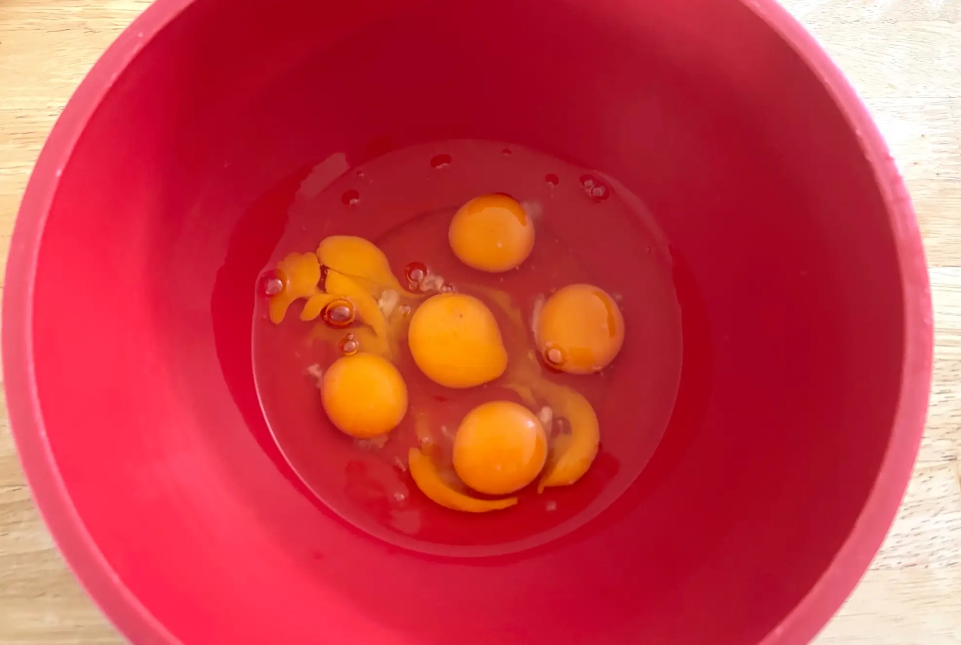 Cracking the eggs for Ina Garten's cacio e pepe eggs