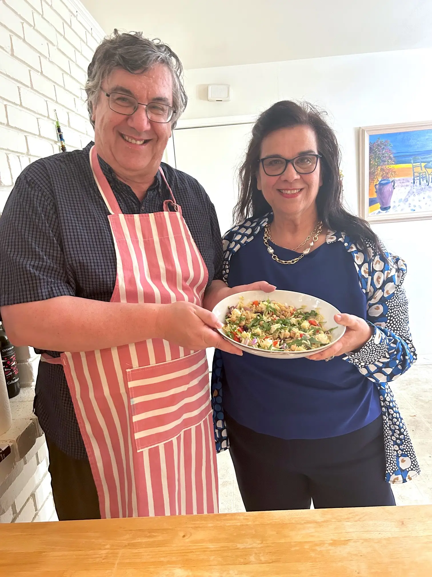 Anneta's parents with Ina Garten's Greek Orzo Salad