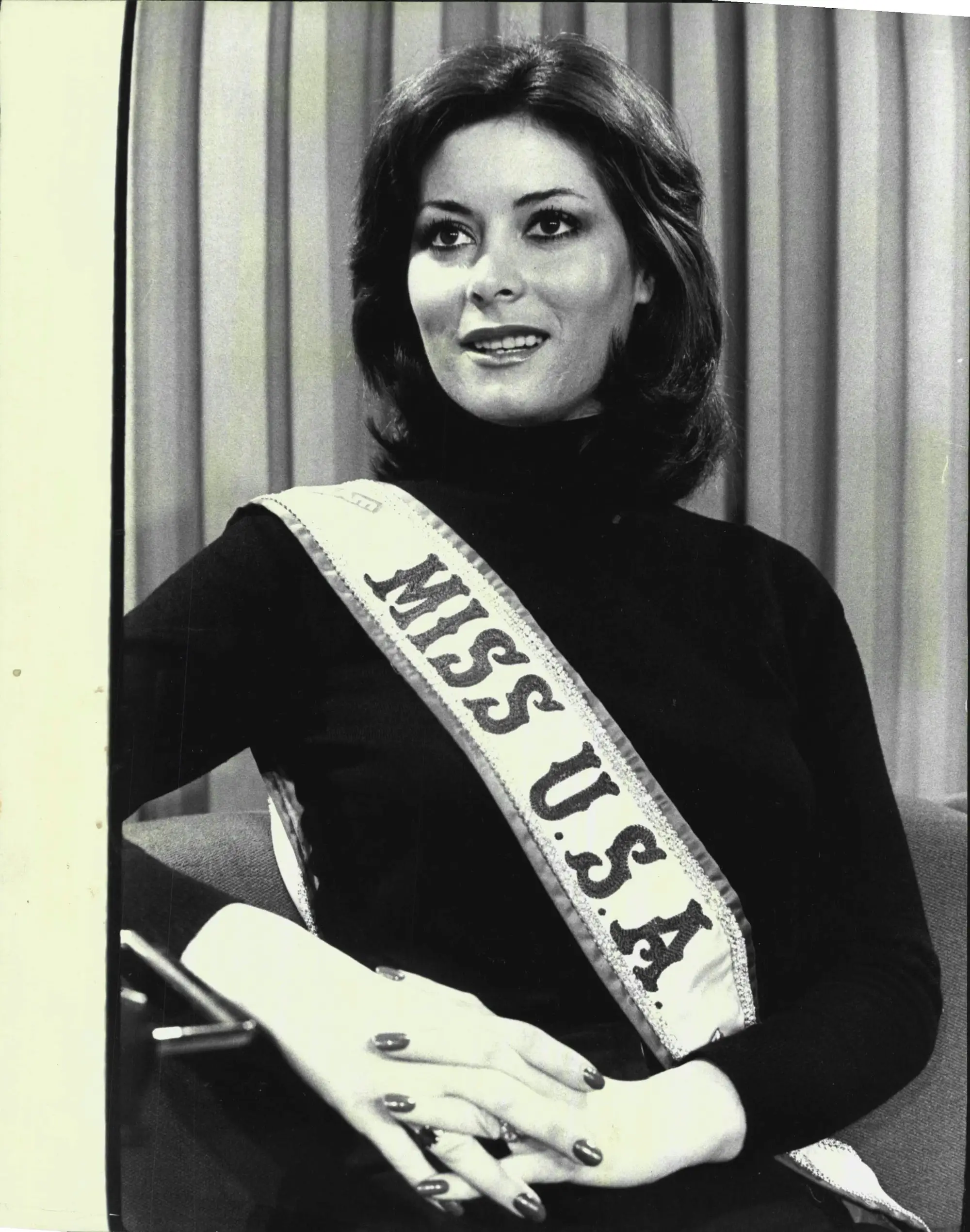 Miss USA 1975 Summer Bartholomew poses in her sash.