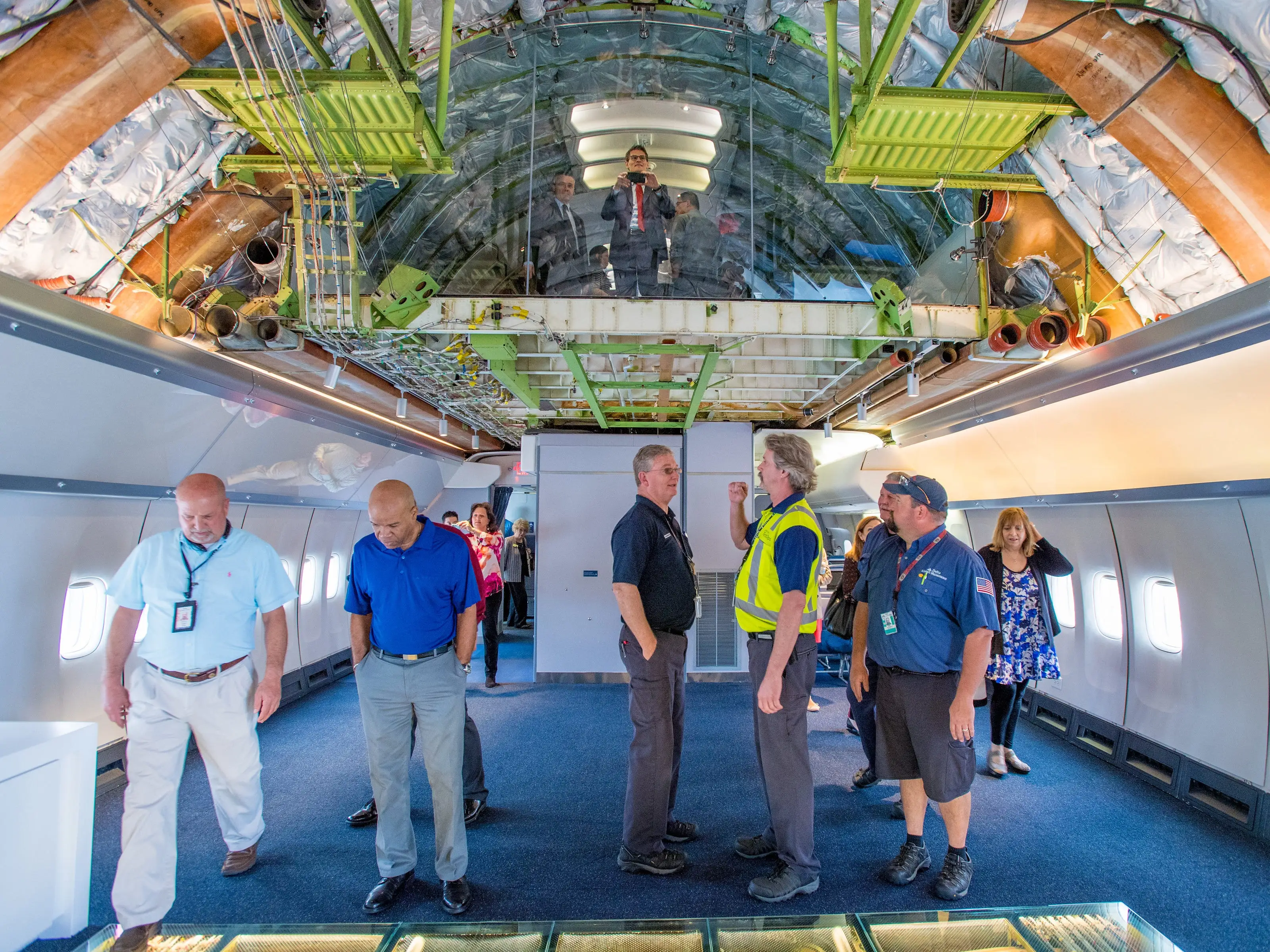 People exploring the interior of Delta's 747 Experience.