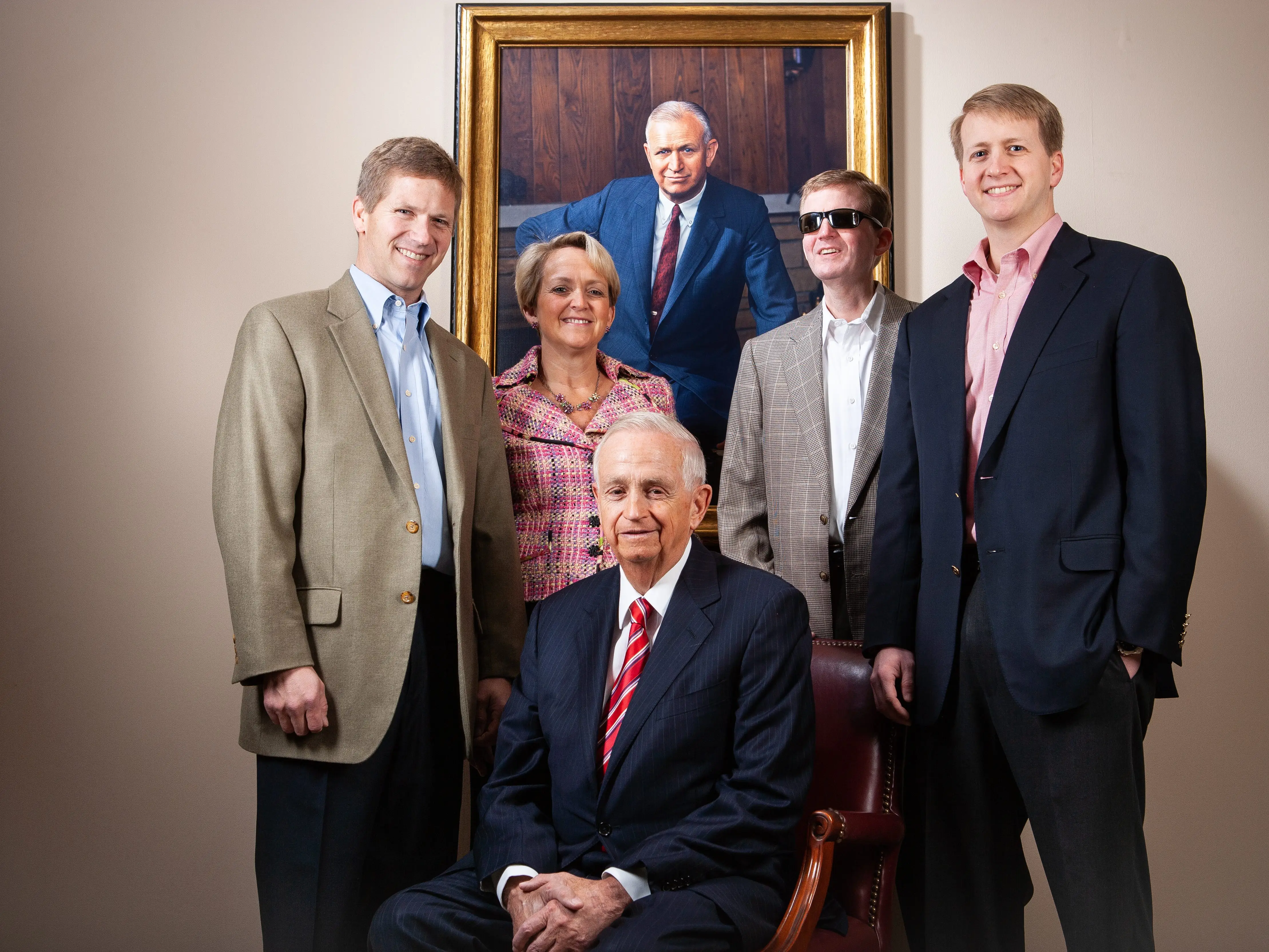 Bill Marriott poses with his children (L-R) John Marriott, Debbie Marriott, Stephen Marriott and David Marriott under the portrait of J.Willard Marriott at the Marriott International Headquarters
