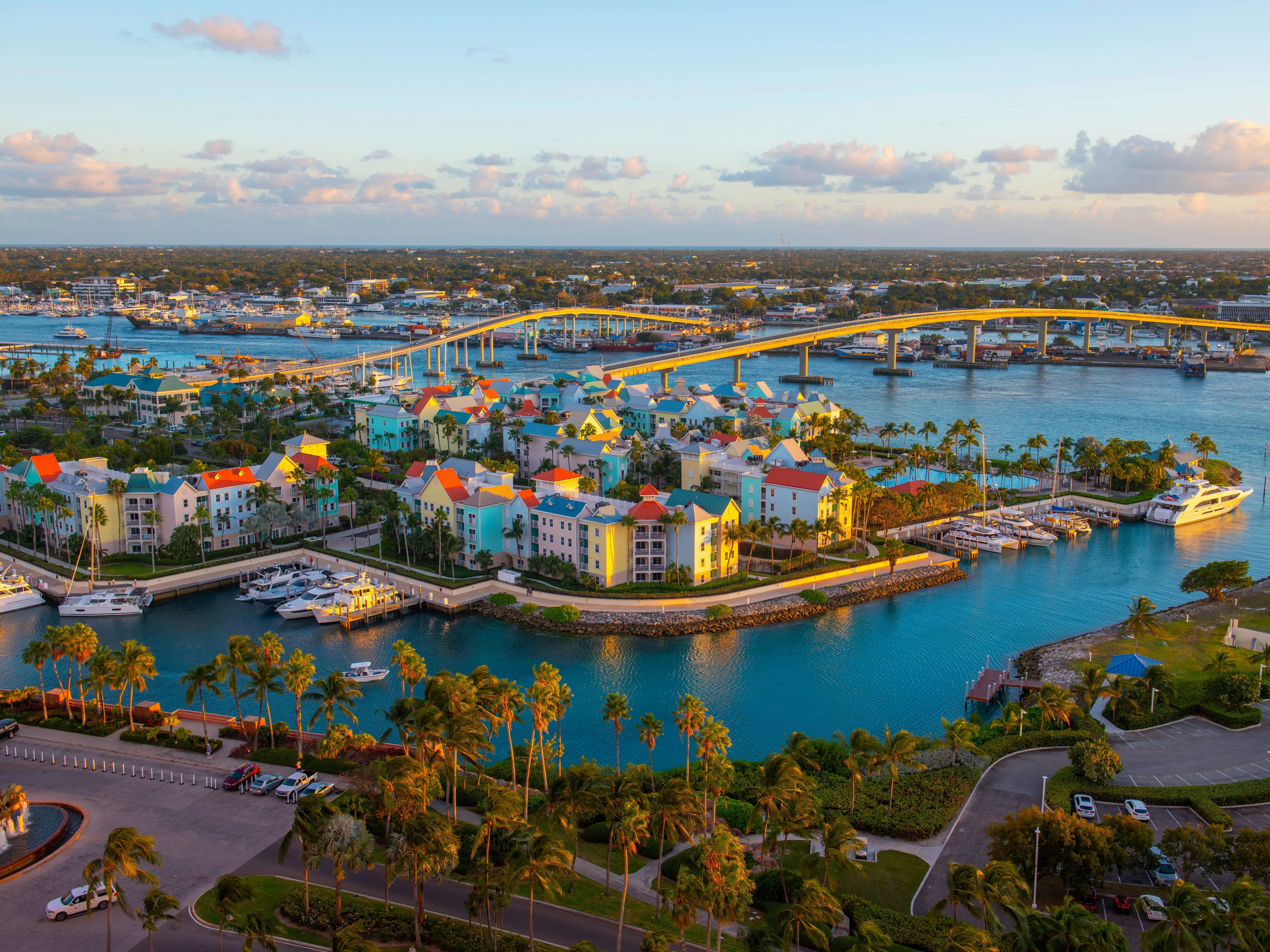 Harborside Villas aerial view at Nassau Harbour with Nassau downtown at the background at sunset, from Paradise Island, Bahamas.
