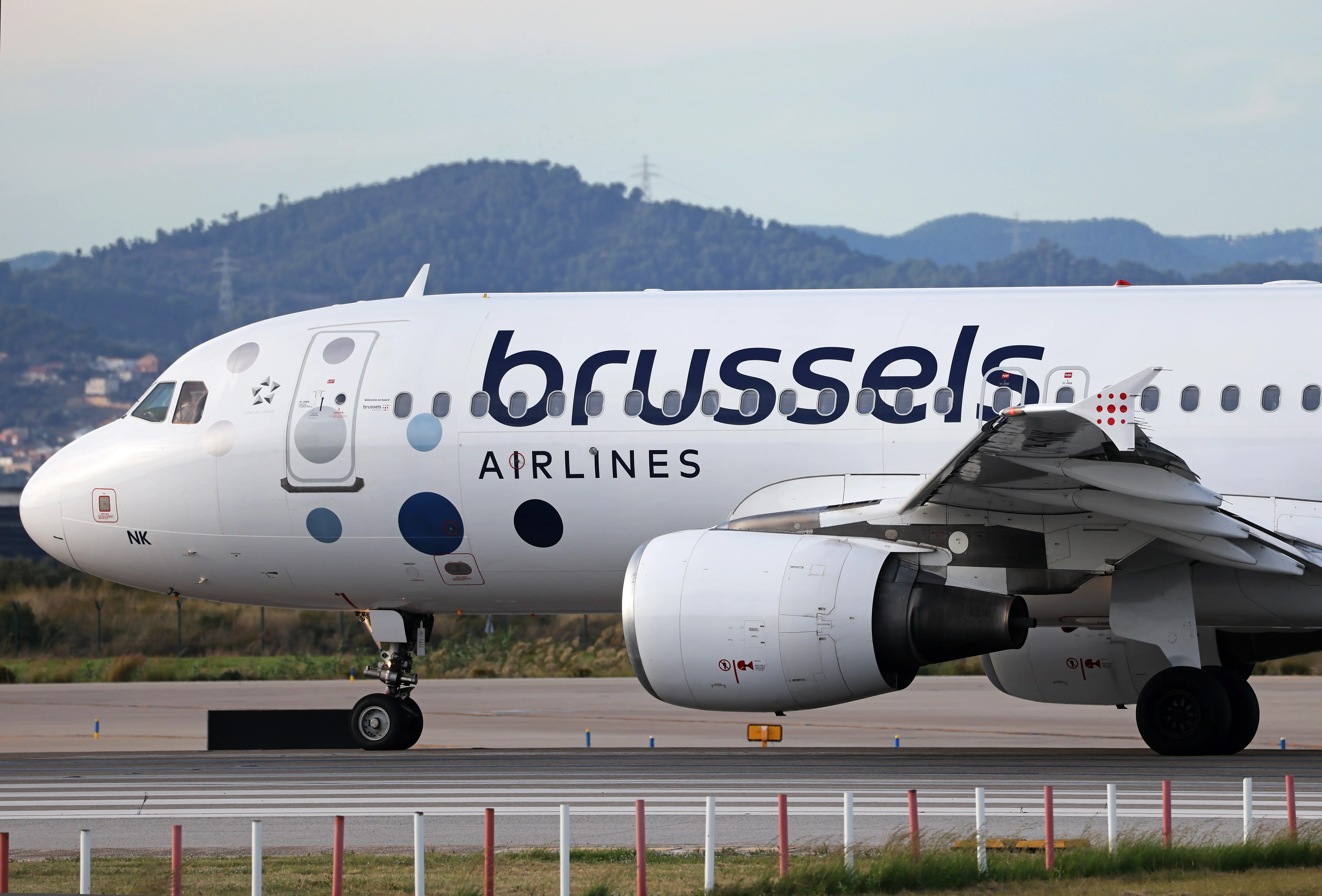A Brussels Airlines Airbus A320-214 prepares for takeoff on the Barcelona airport runway in Barcelona, Spain, on October 31, 2025.