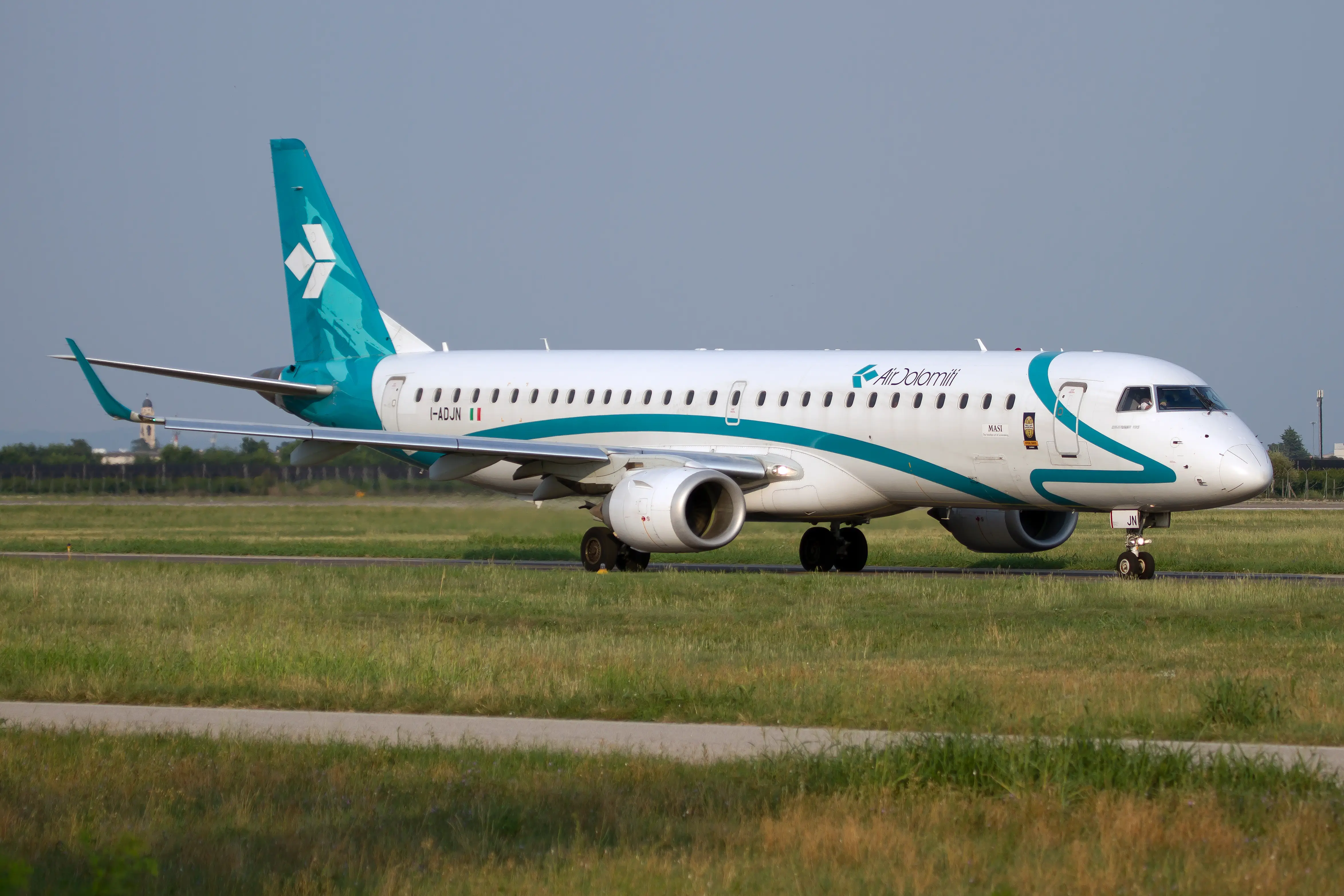Air Dolomiti Embraer 190 seen landing at Verona Villafranca airport.