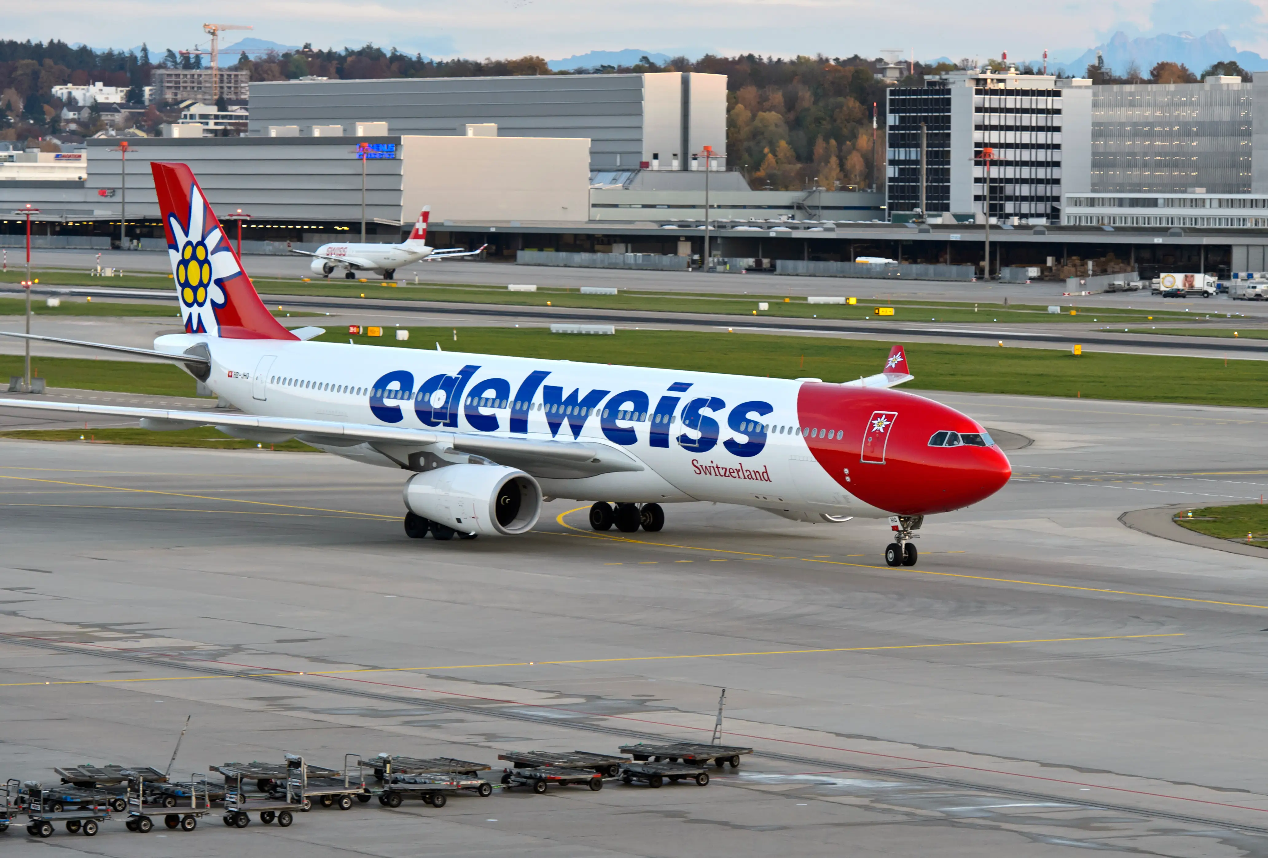 Airbus A330 of Swiss leisure airline Edelweiss Air taxis to the arrival gate at Zurich Airport, Zurich, Switzerland .