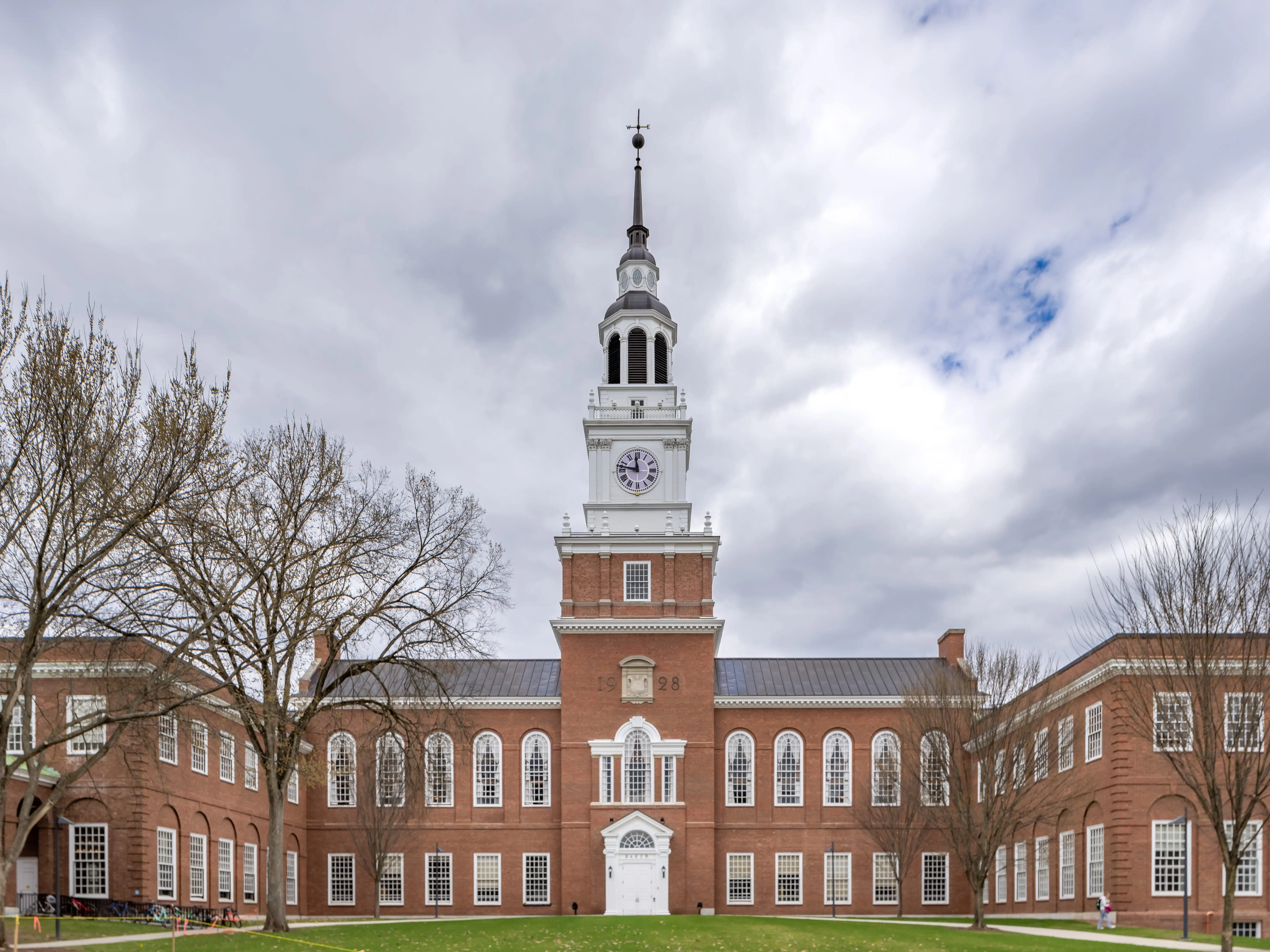 Iconic photo of Baker-Berry Library, Dartmouth College located in Hanover, New Hampshire, USA on a mostly cloudy spring day.