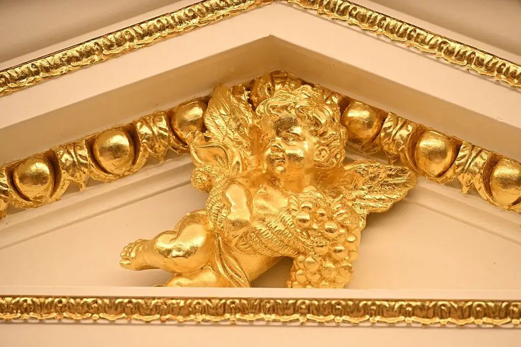 A gold cherub in the Oval Office.