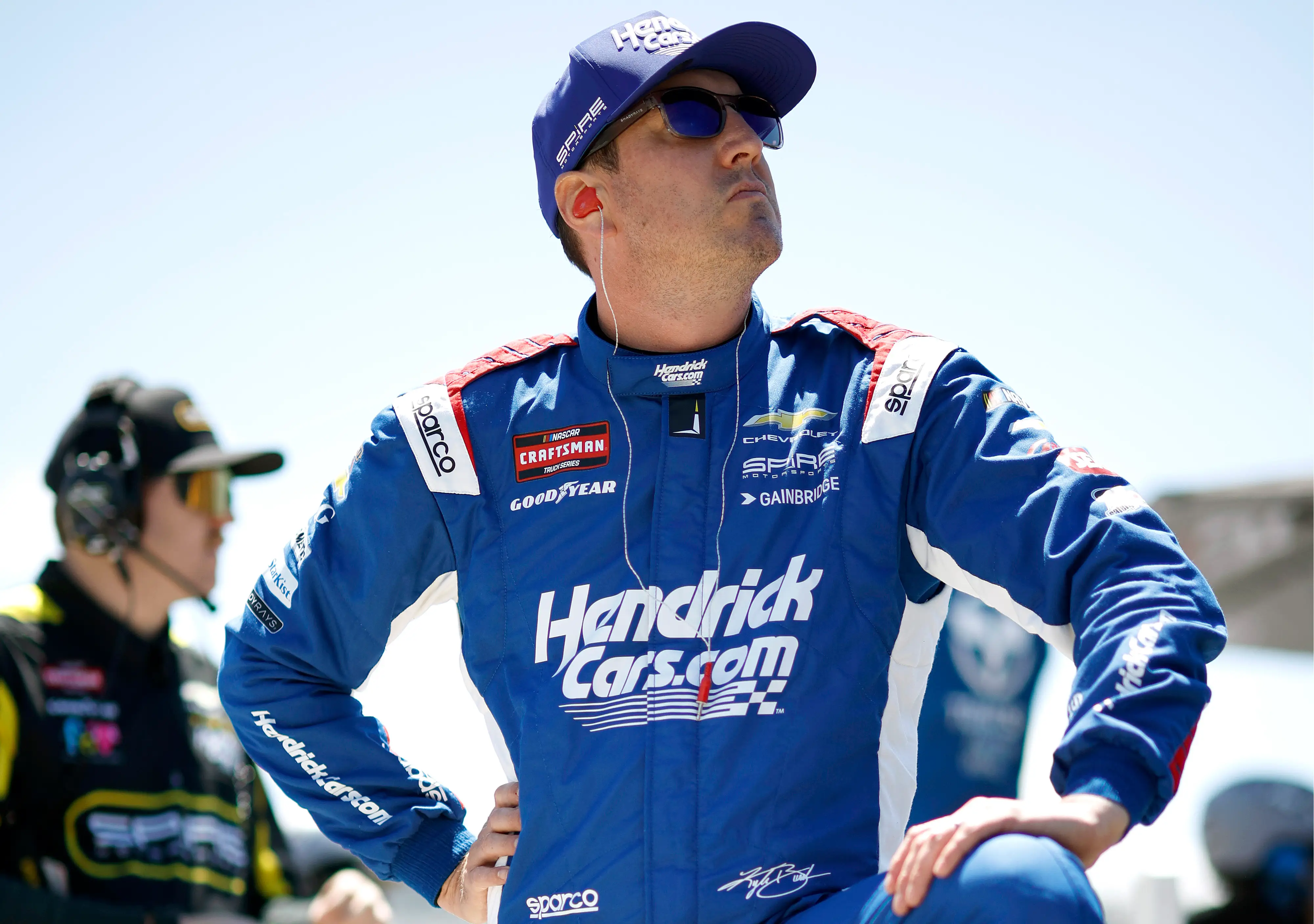 Kyle Busch in a blue race suit and hat