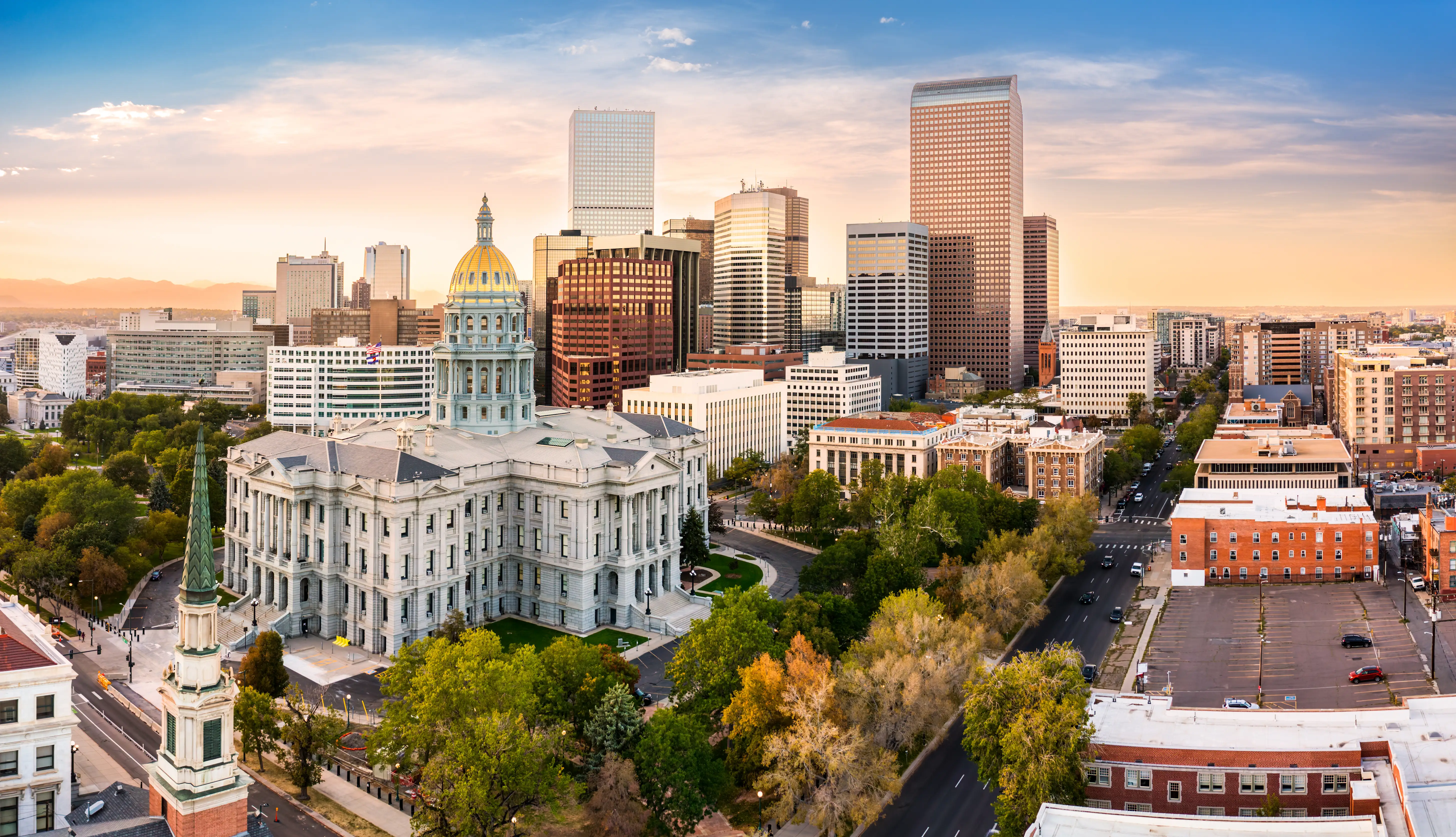 Aerial view of Denver, Colorado skyline at sunset.
