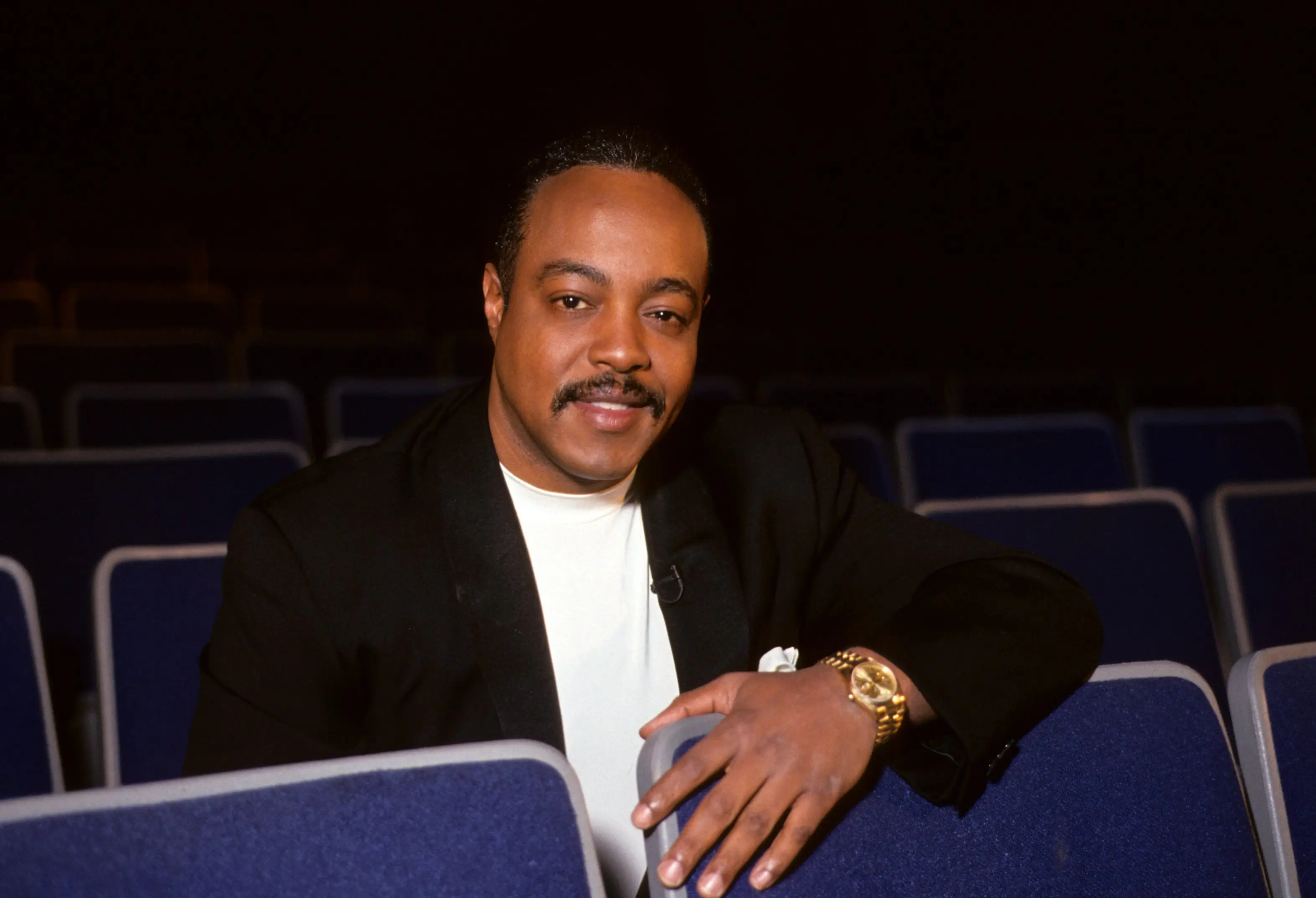 Peabo Bryson sitting on a blue chair