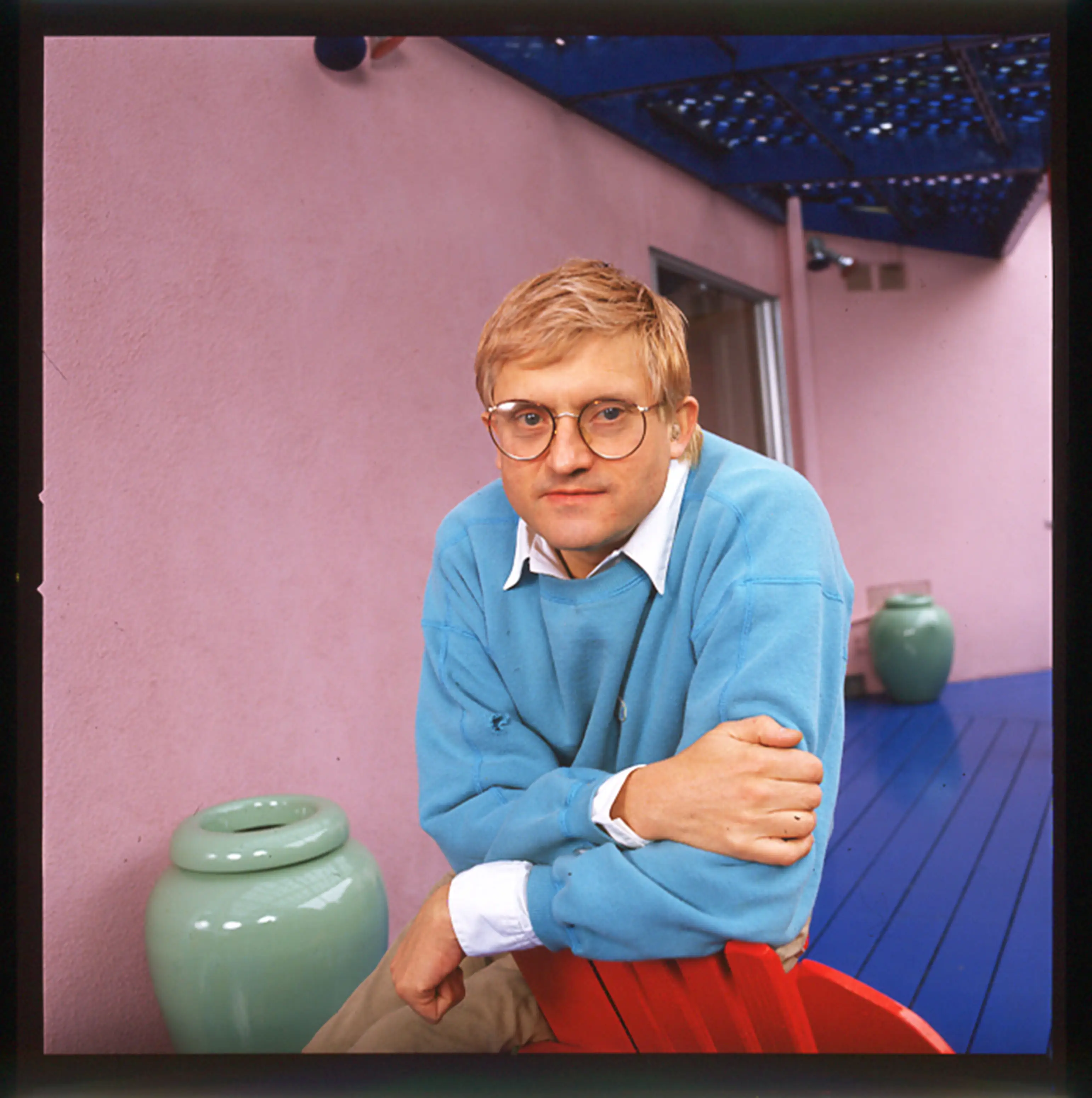David Hockney poses for a portrait in his Los Angeles home in 1987.