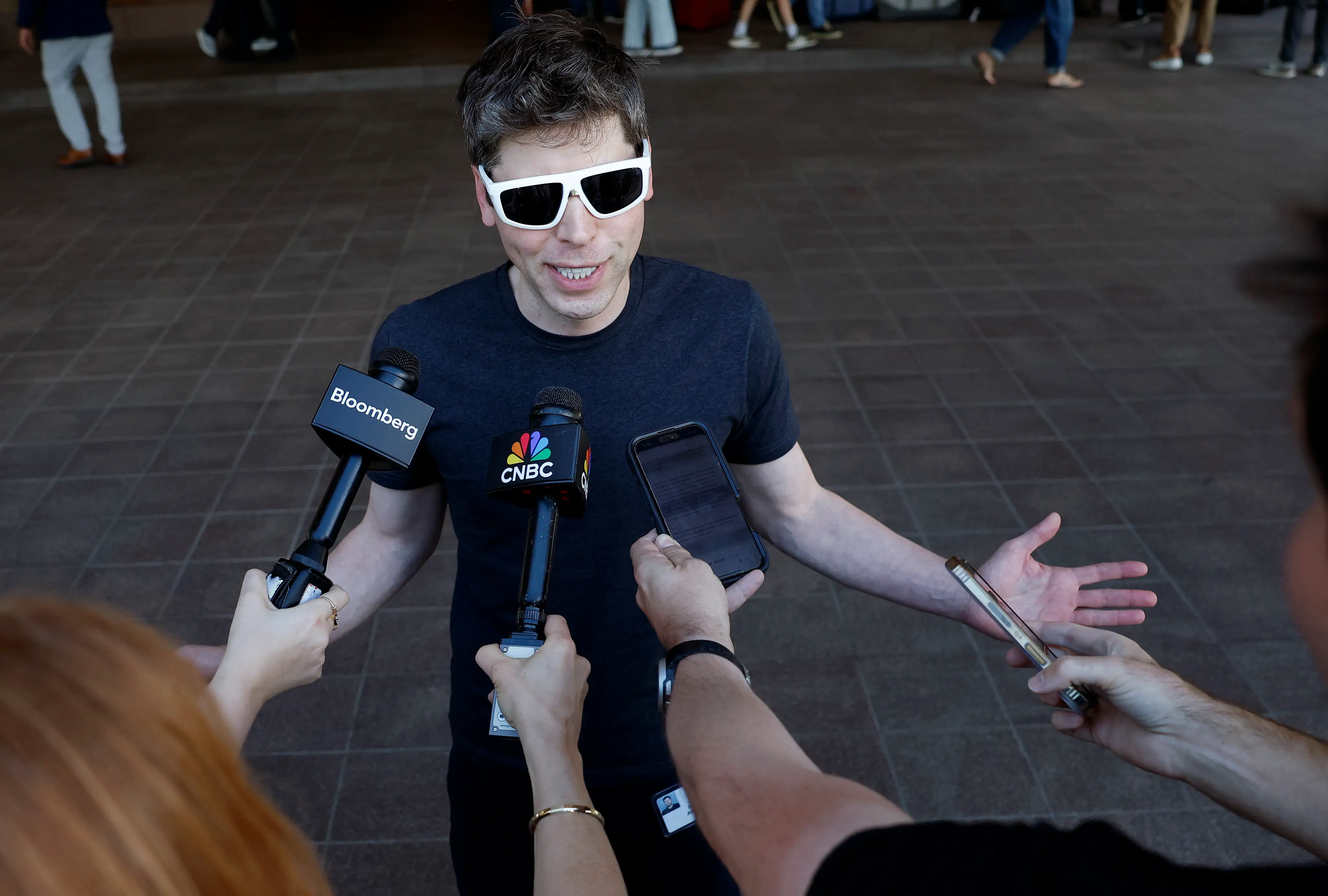 CEO of OpenAI Sam Altman speaks to members of the media as he arrives at the Sun Valley l