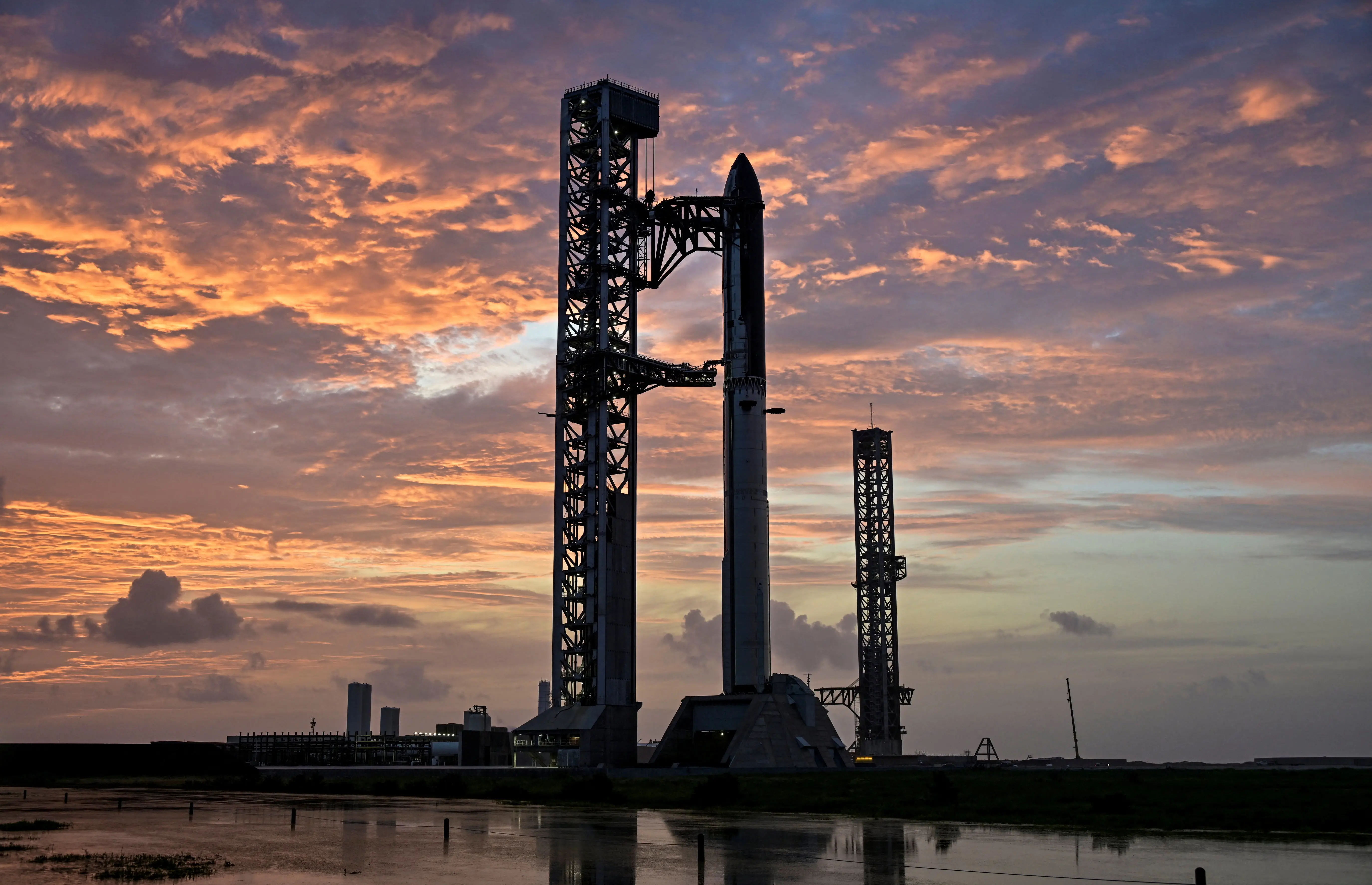 The SpaceX Starship and Super Heavy v3 Booster stand at pad 2 at sunrise before its 13th test flight from the SpaceX launch complex in Starbase, Texas, U.S., July 16, 2026. REUTERS/Steve Nesius