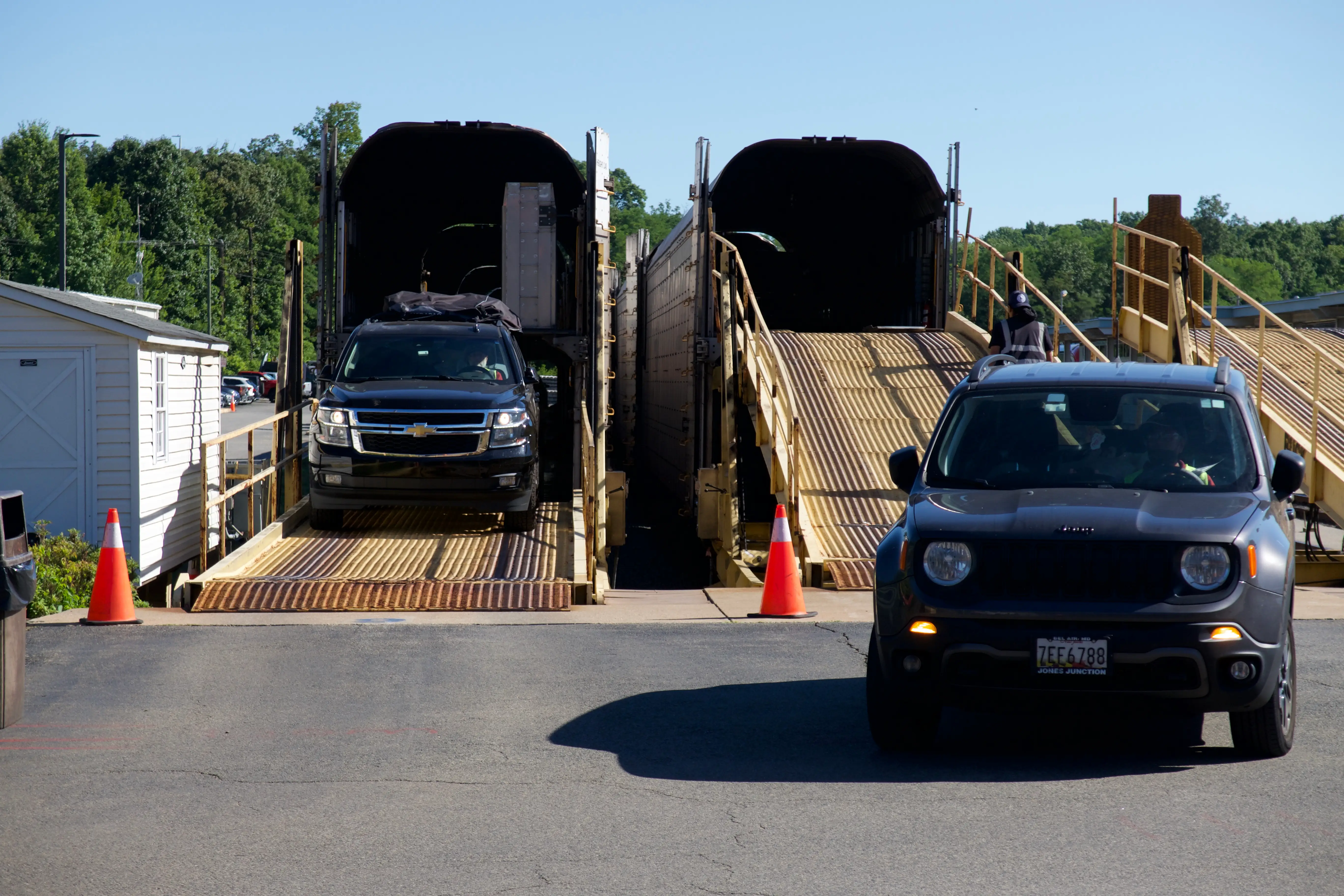 Cars being driven off of Amtrak Auto Train