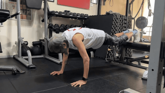 A woman doing push-ups.