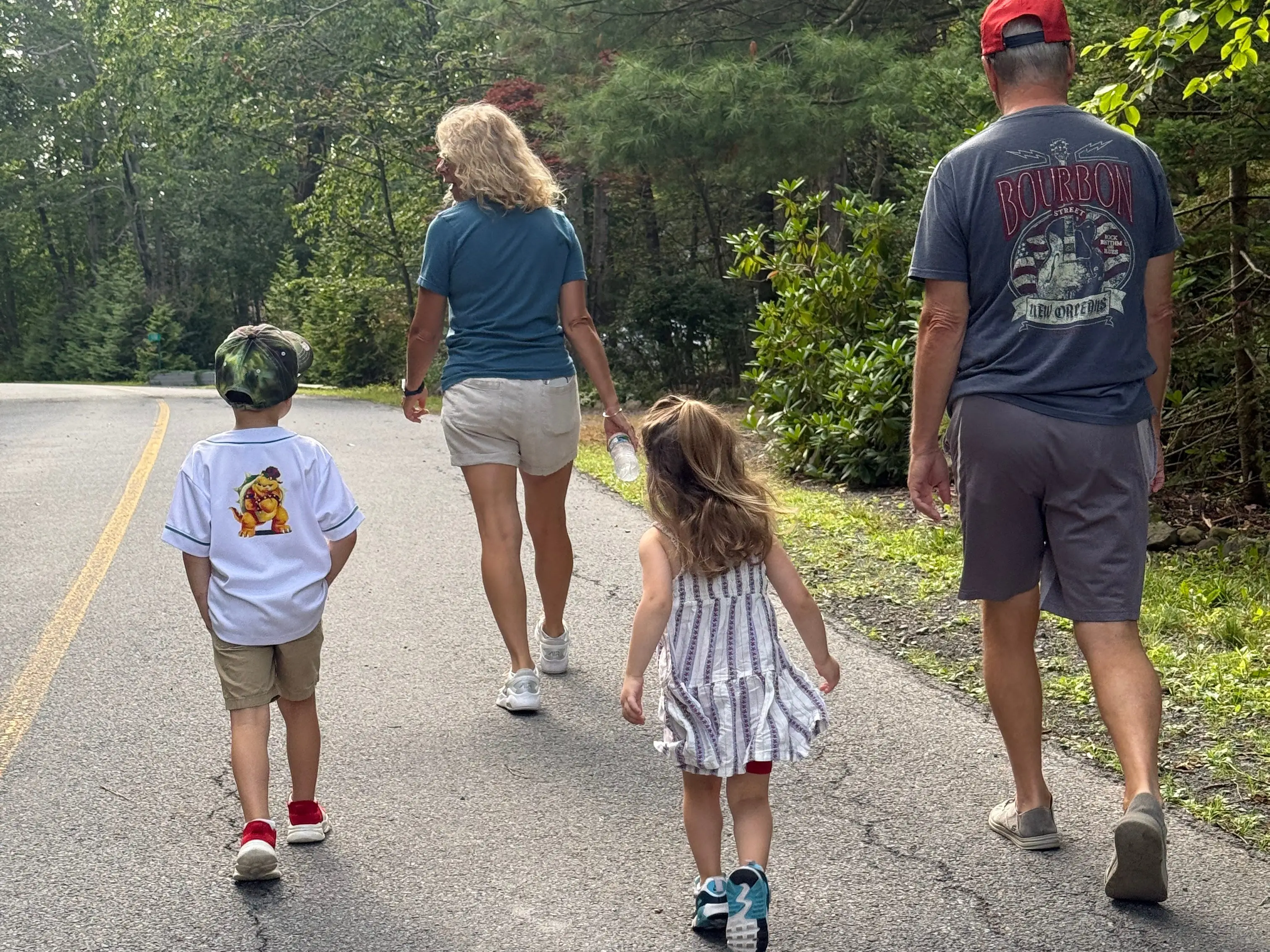 Kids walking with two adults