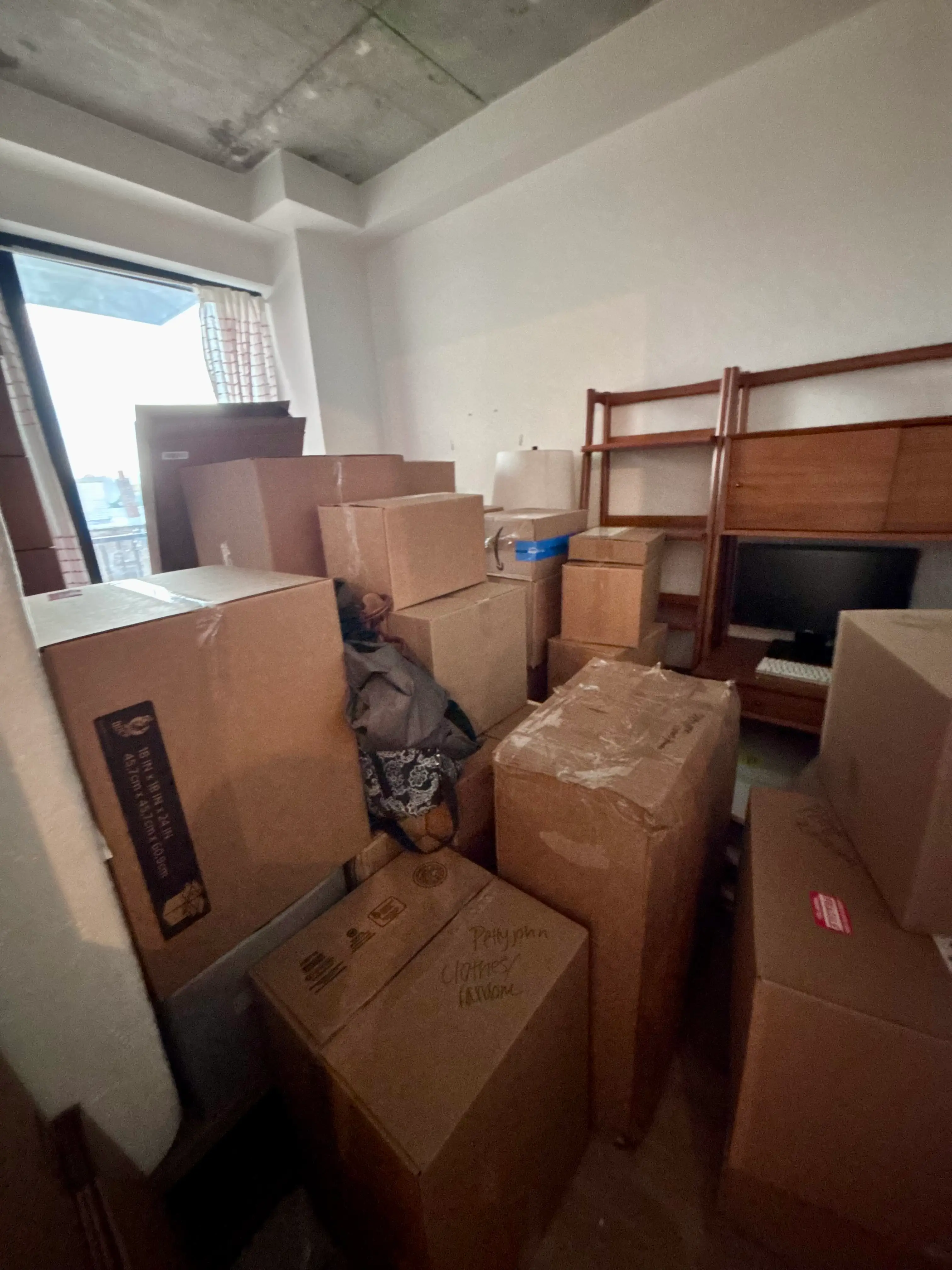 A photo of a room full of boxes.