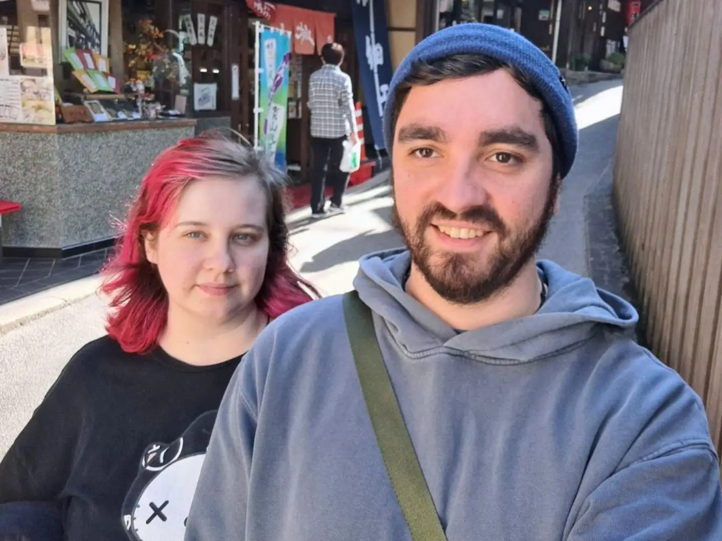 Man and woman smiling in Japan