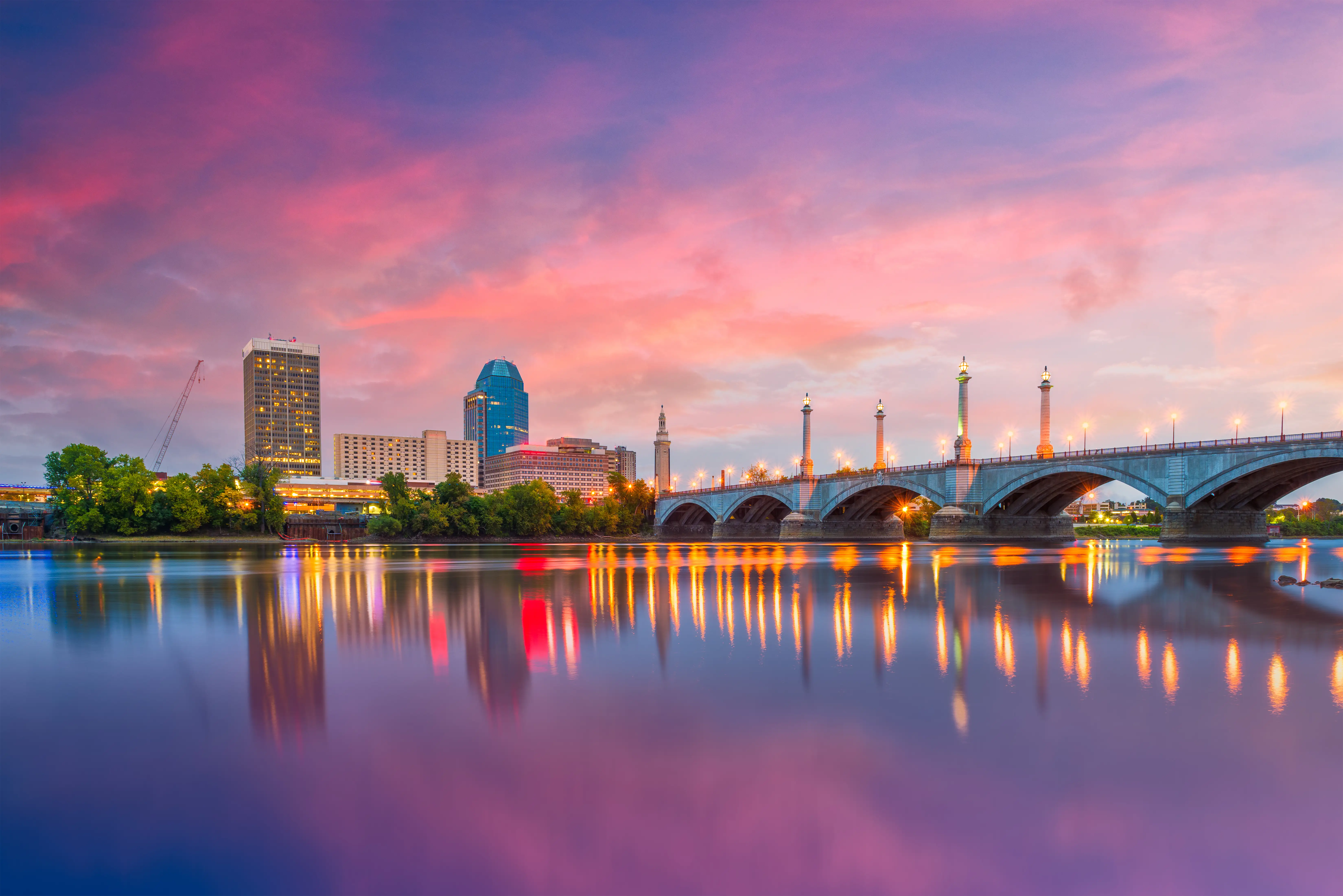 Springfield, Massachusetts, downtown skyline on the river at dusk.