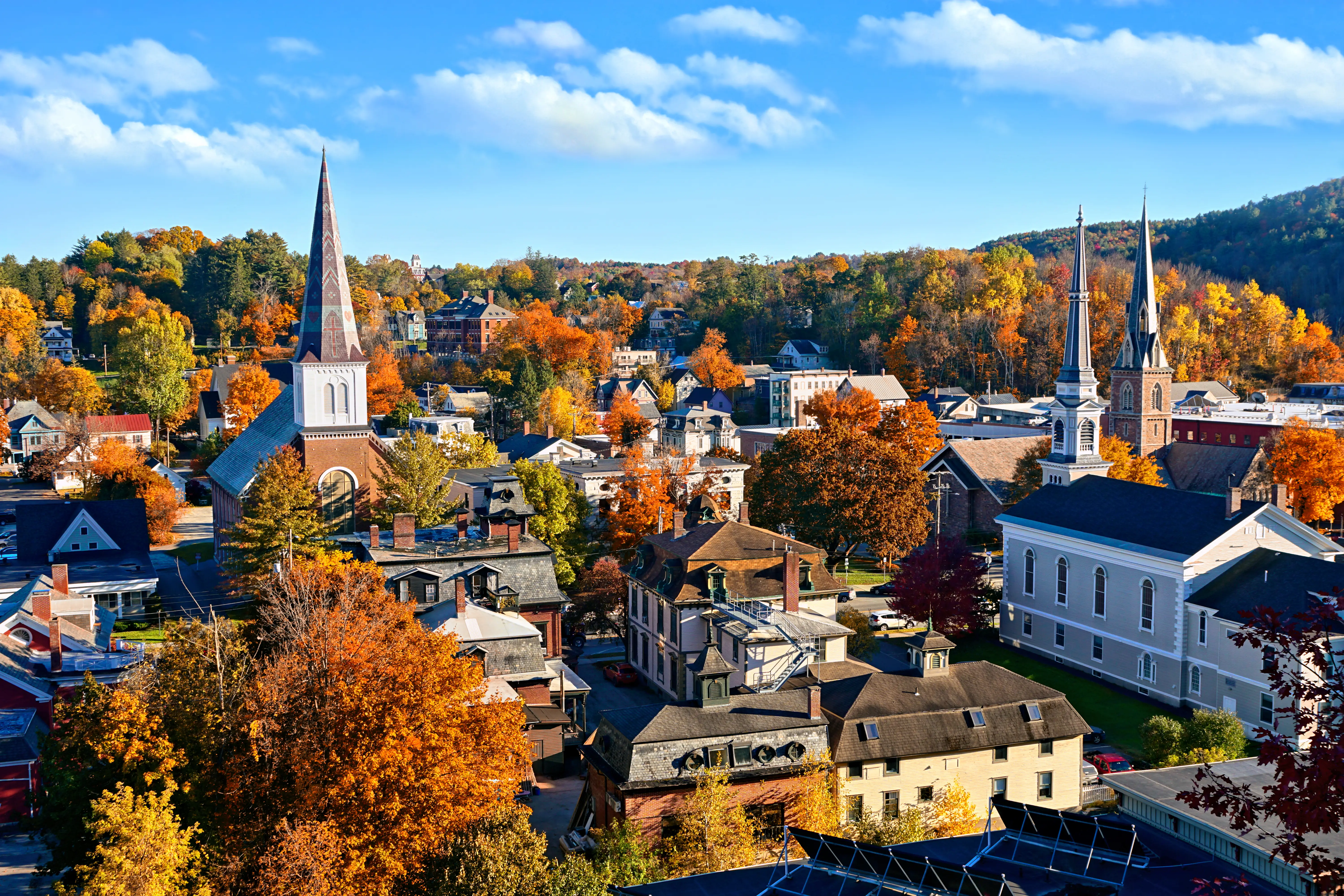 Autumn view over the historic city of Montpelier, Vermont, with church spires and colorful fall leaves