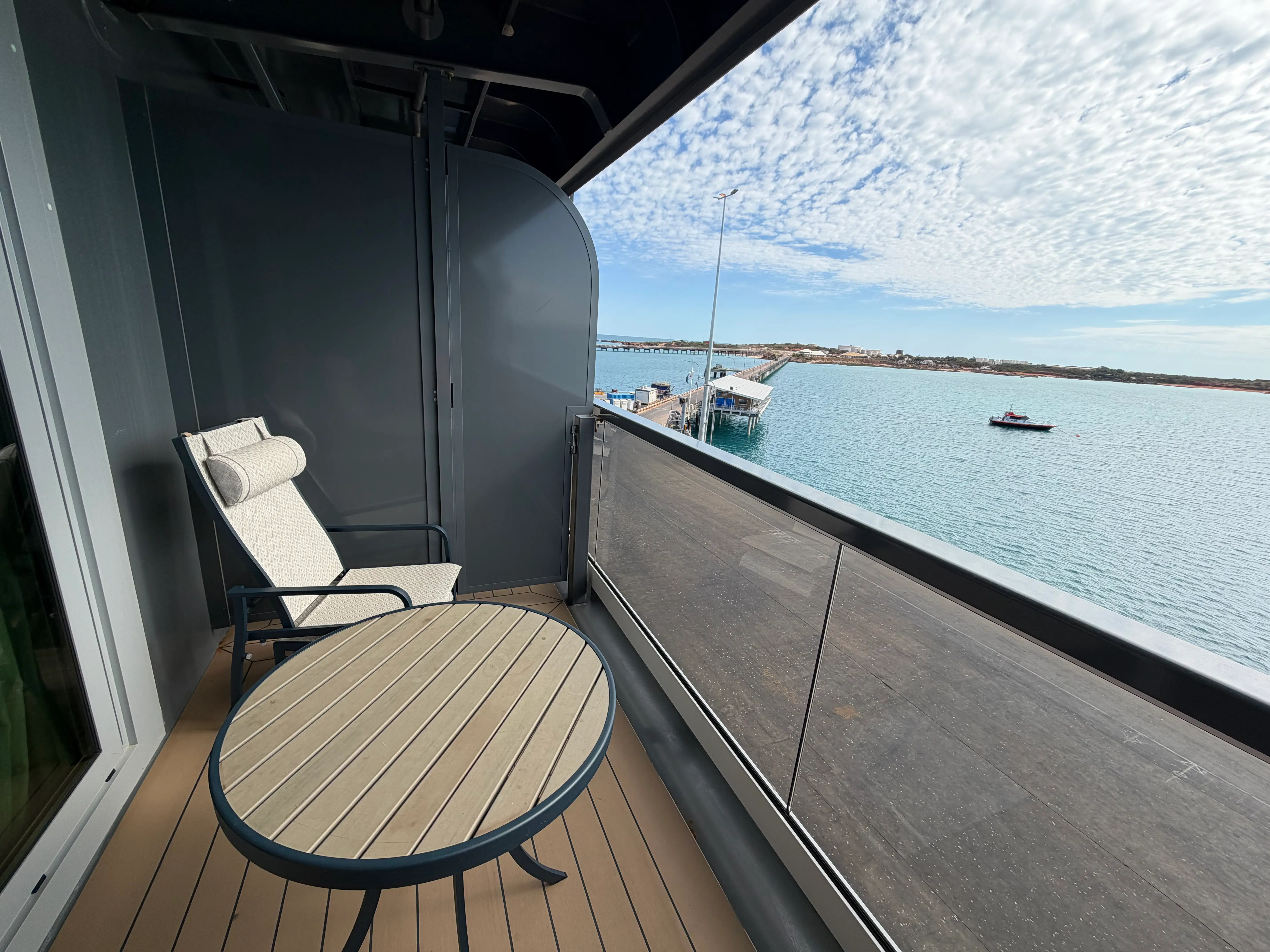 Seabourn room balcony area with small table, chair, over