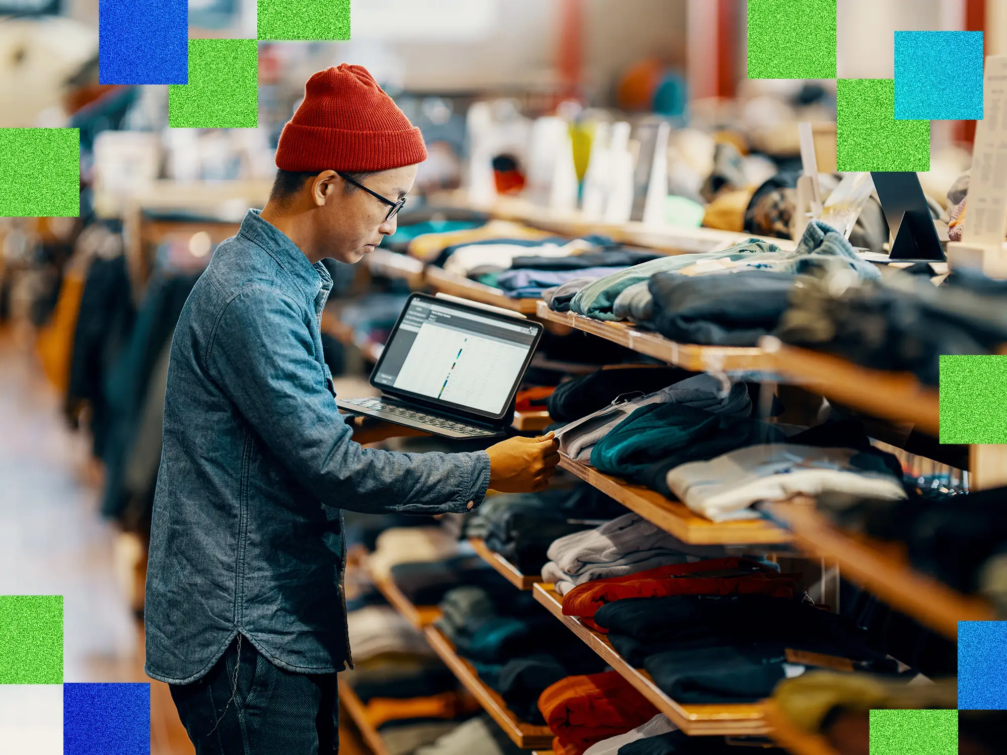 Mid adult male checking or looking for inventory in a retail clothing shop