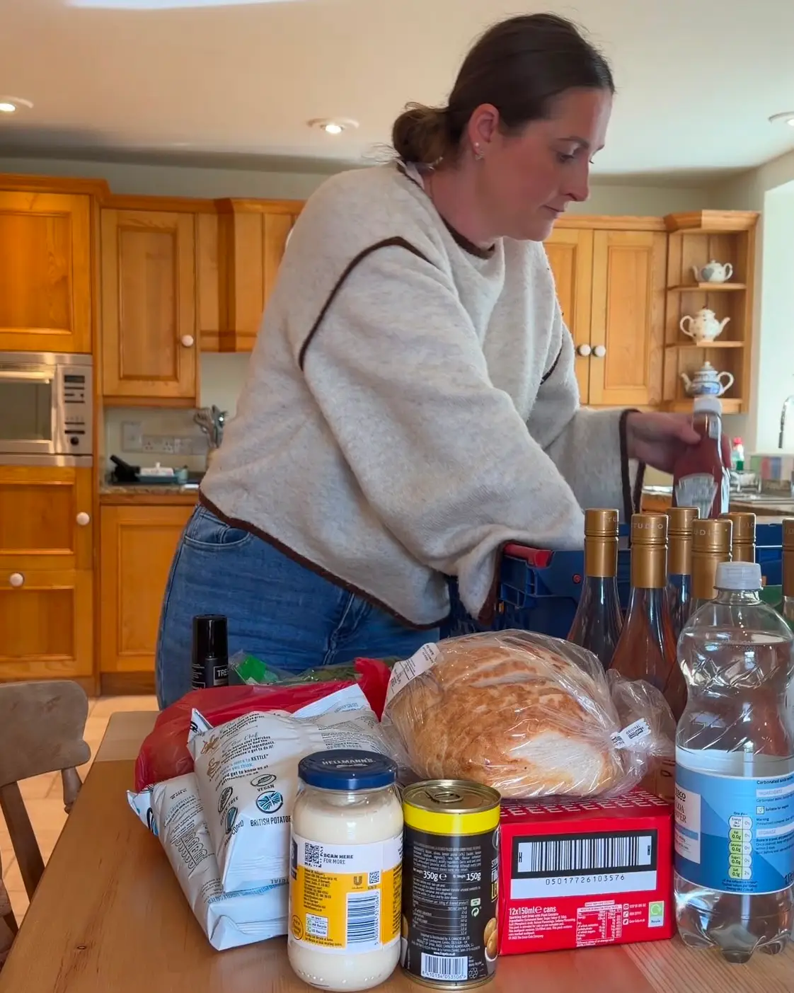 Abbie Manning unpacks shopping.