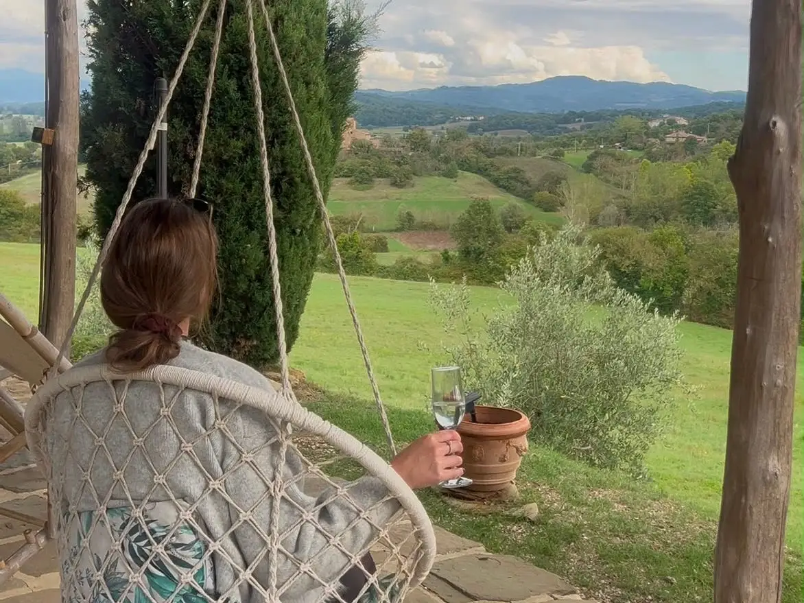 Abbie Manning sat on a chair overlooking rolling Tuscan hills.