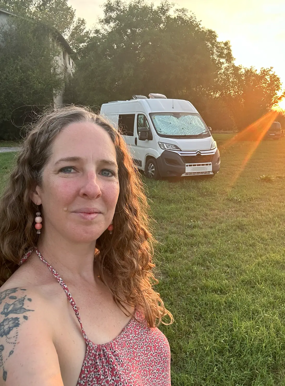 Rin Hamburgh standing in front of her camper van