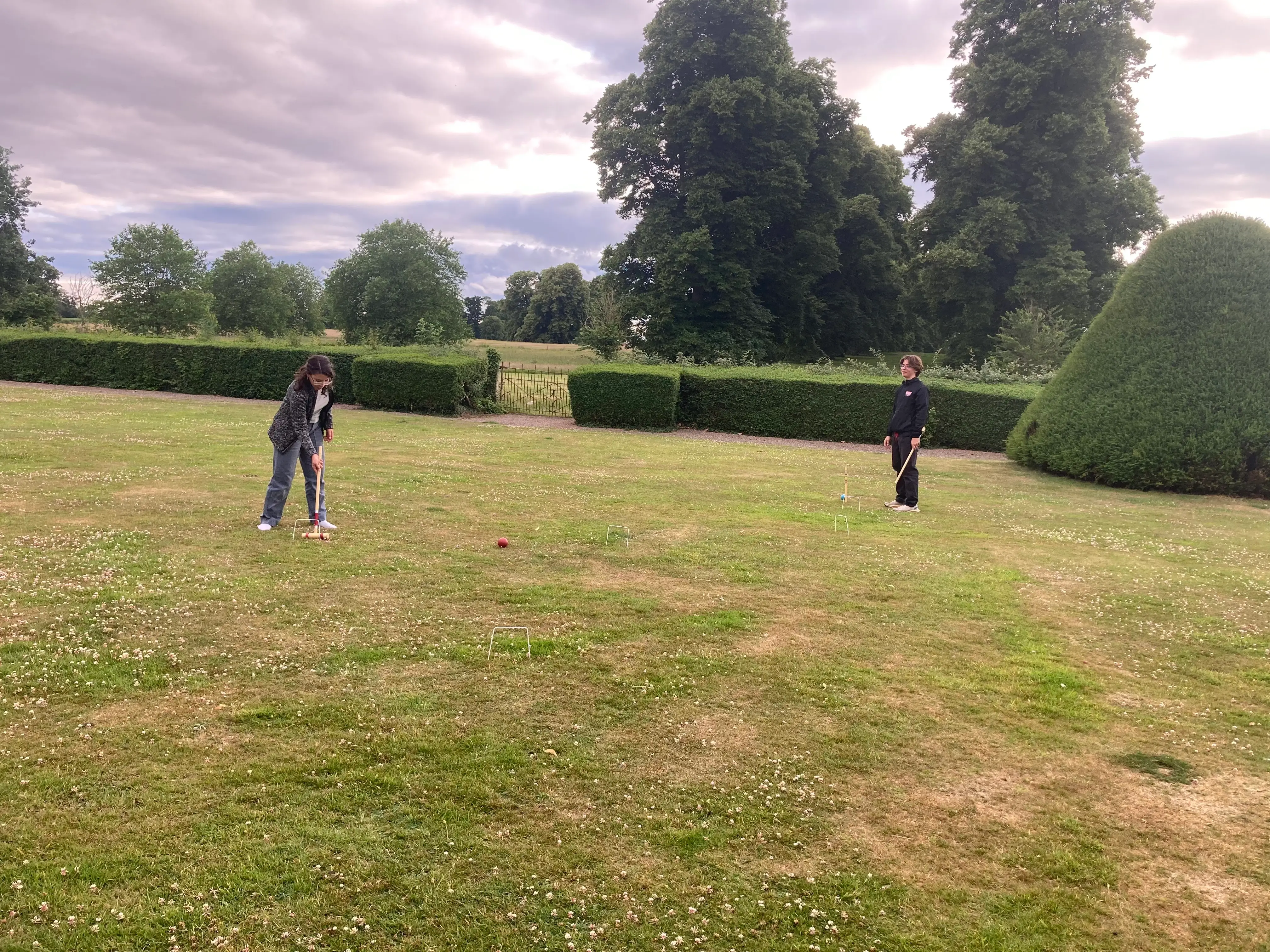 Children playing croquet.