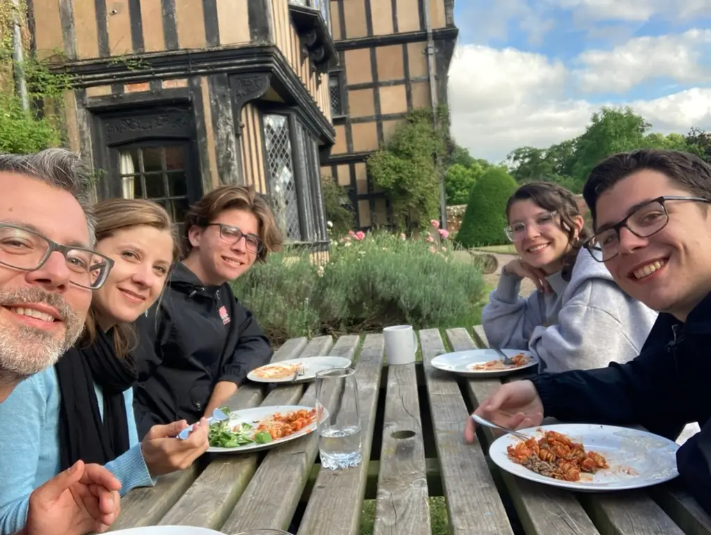 A family dining outside.