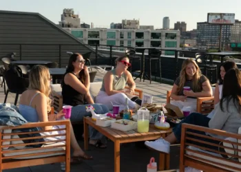 Third places are out, as prices rise. Hosting dinners, craft nights, and book clubs are in.