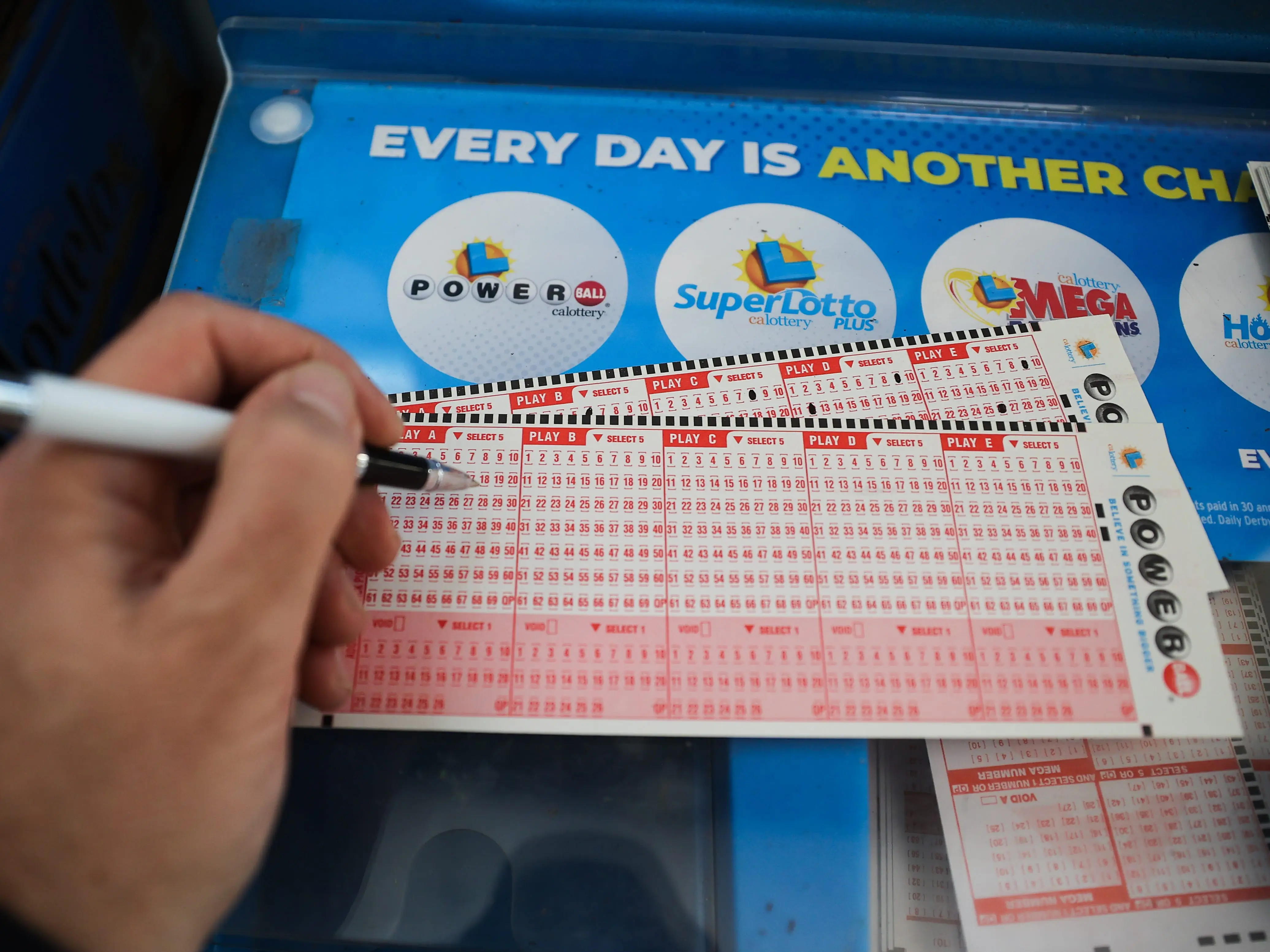 A person plays Powerball lottery at a 7-Eleven store in Milpitas, California, United States on November 7, 2022.