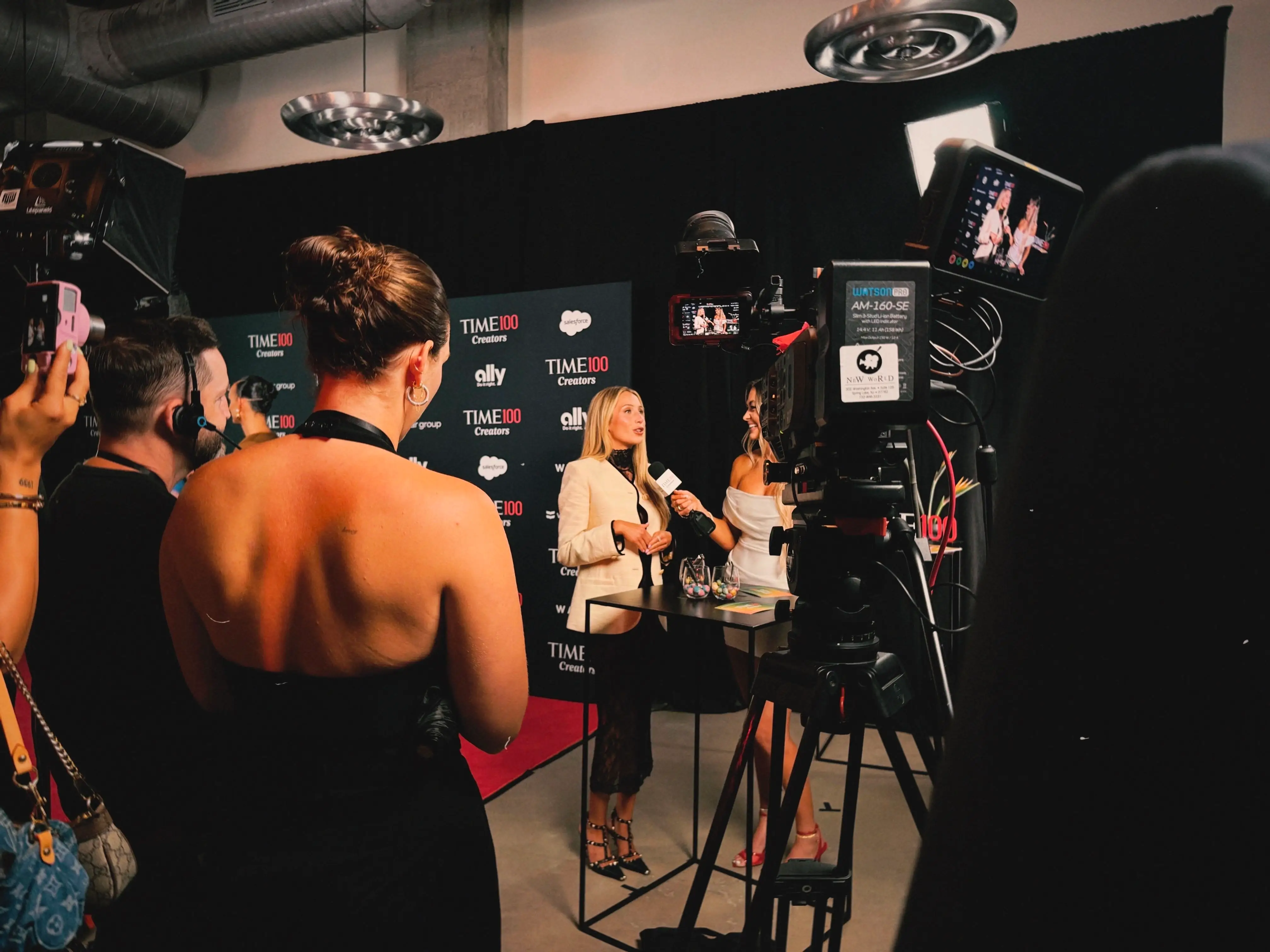 Alix Earle giving an interview at TIME's red carpet.