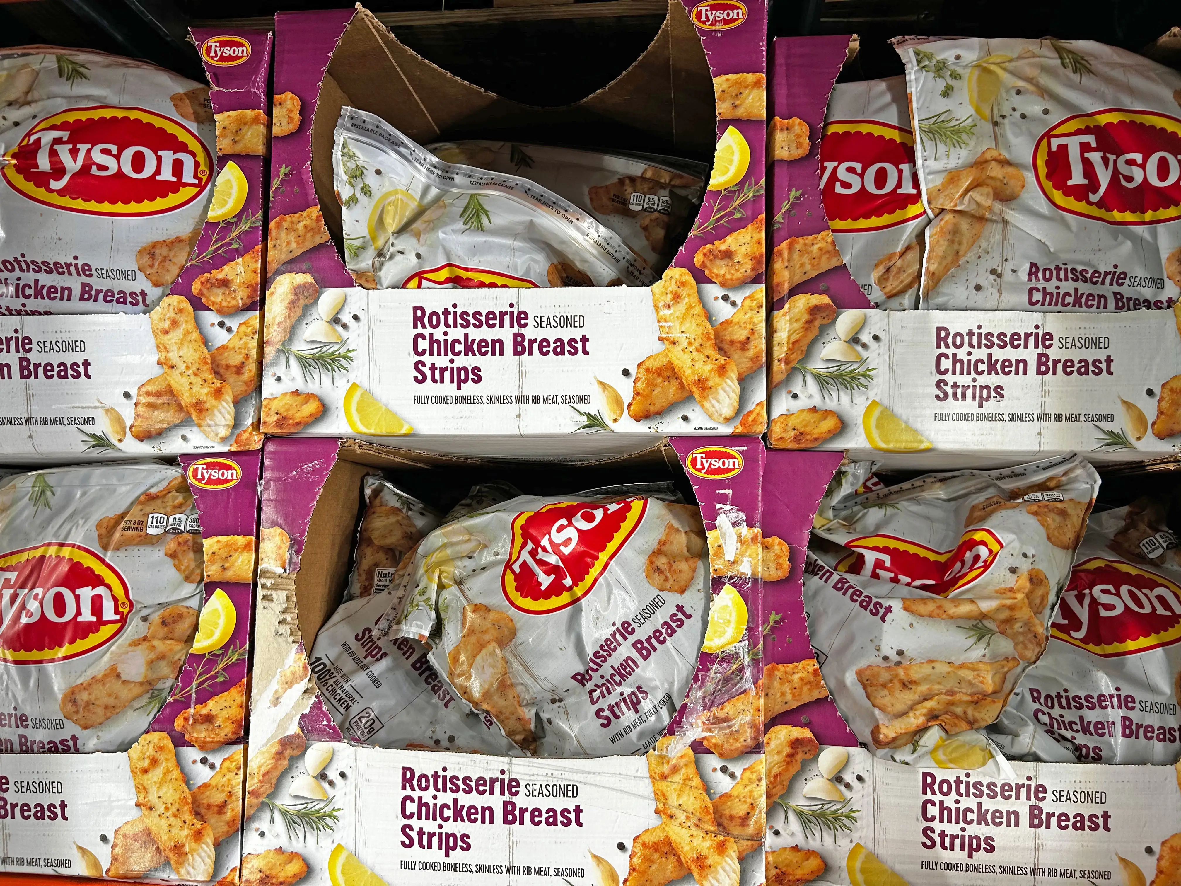Bags of Tyson rotisserie chicken breast strips.