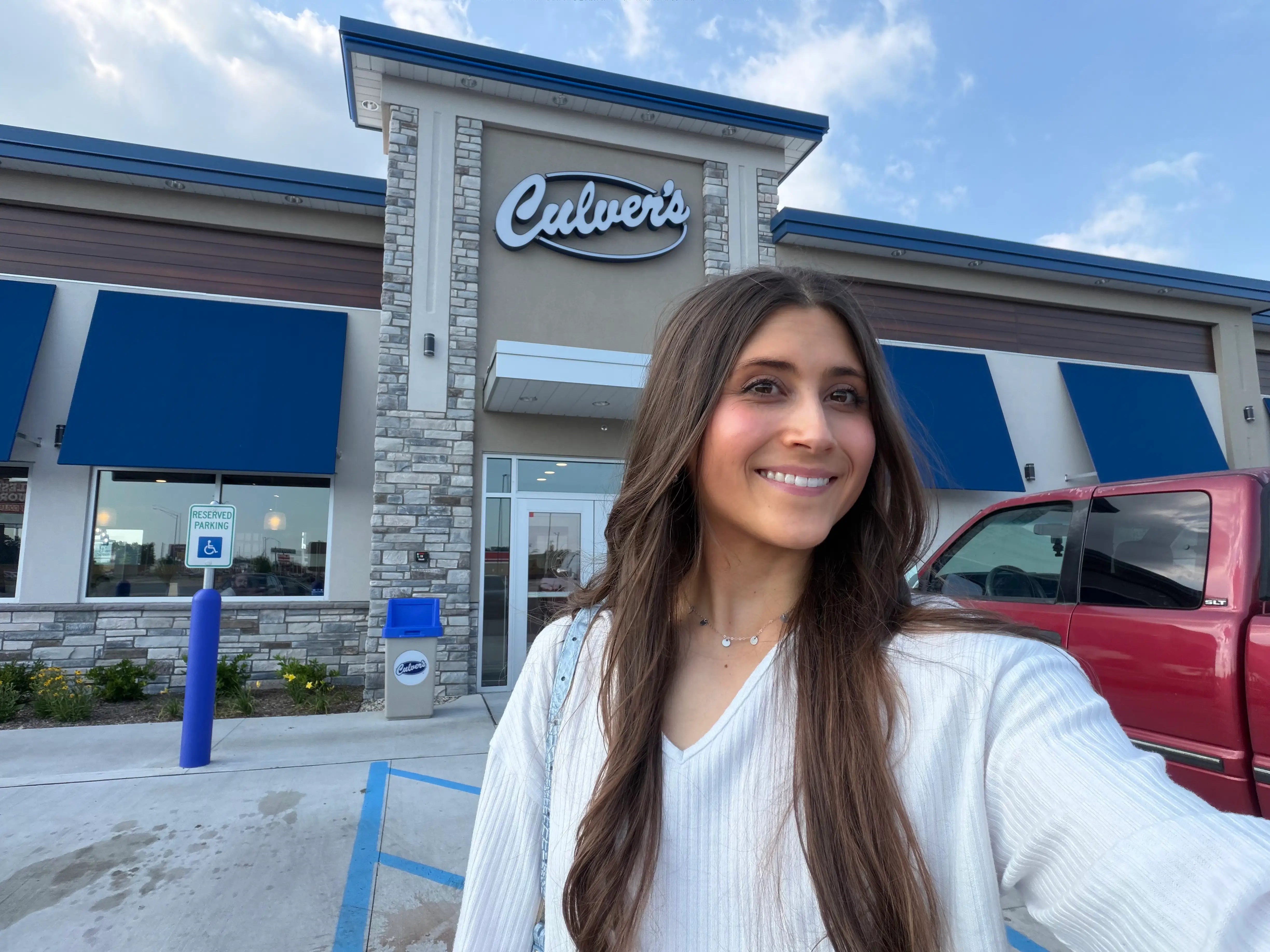 Woman smiling outside of Culver's