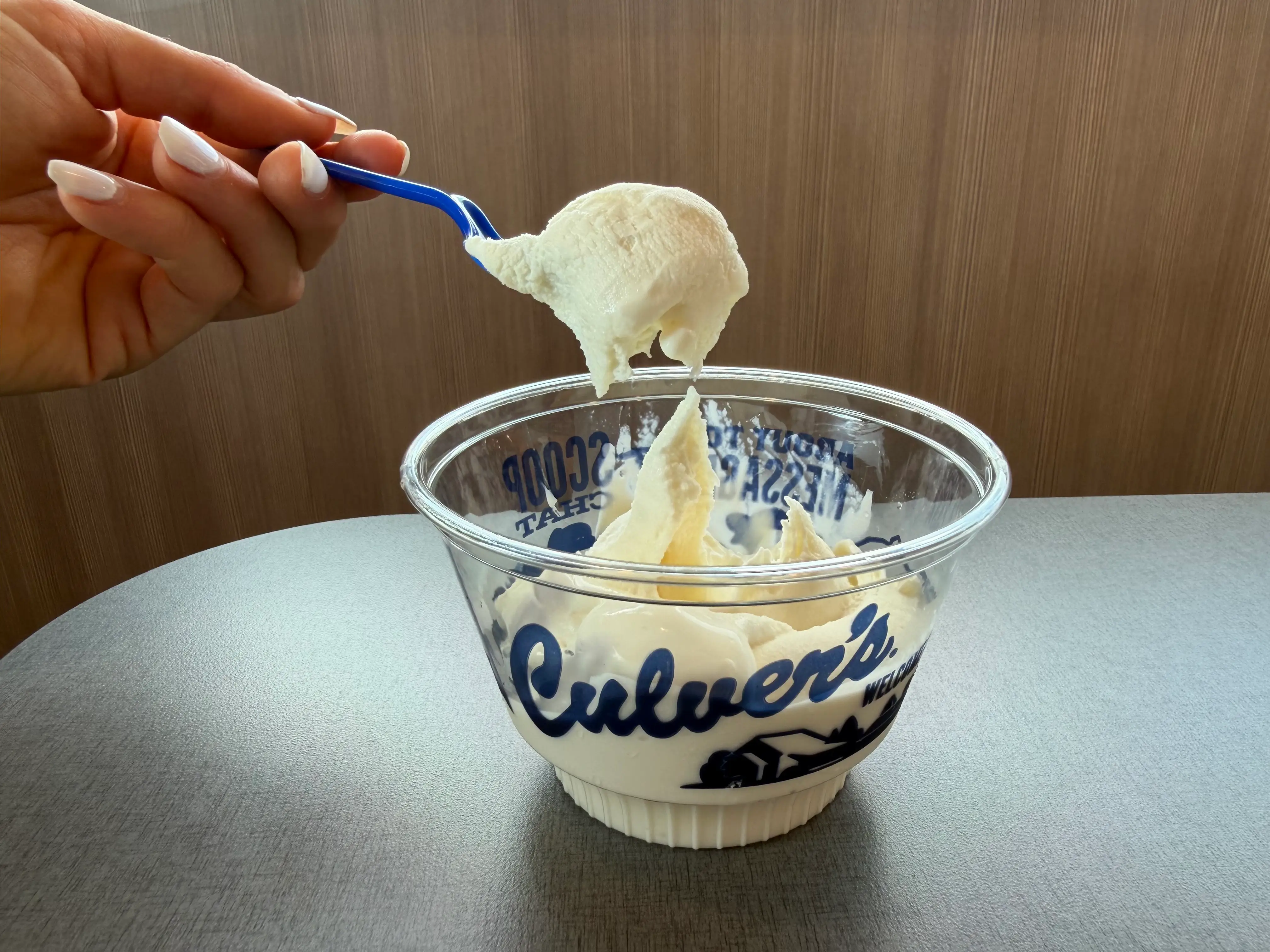 Spoon scooping up vanilla custard at Culver's