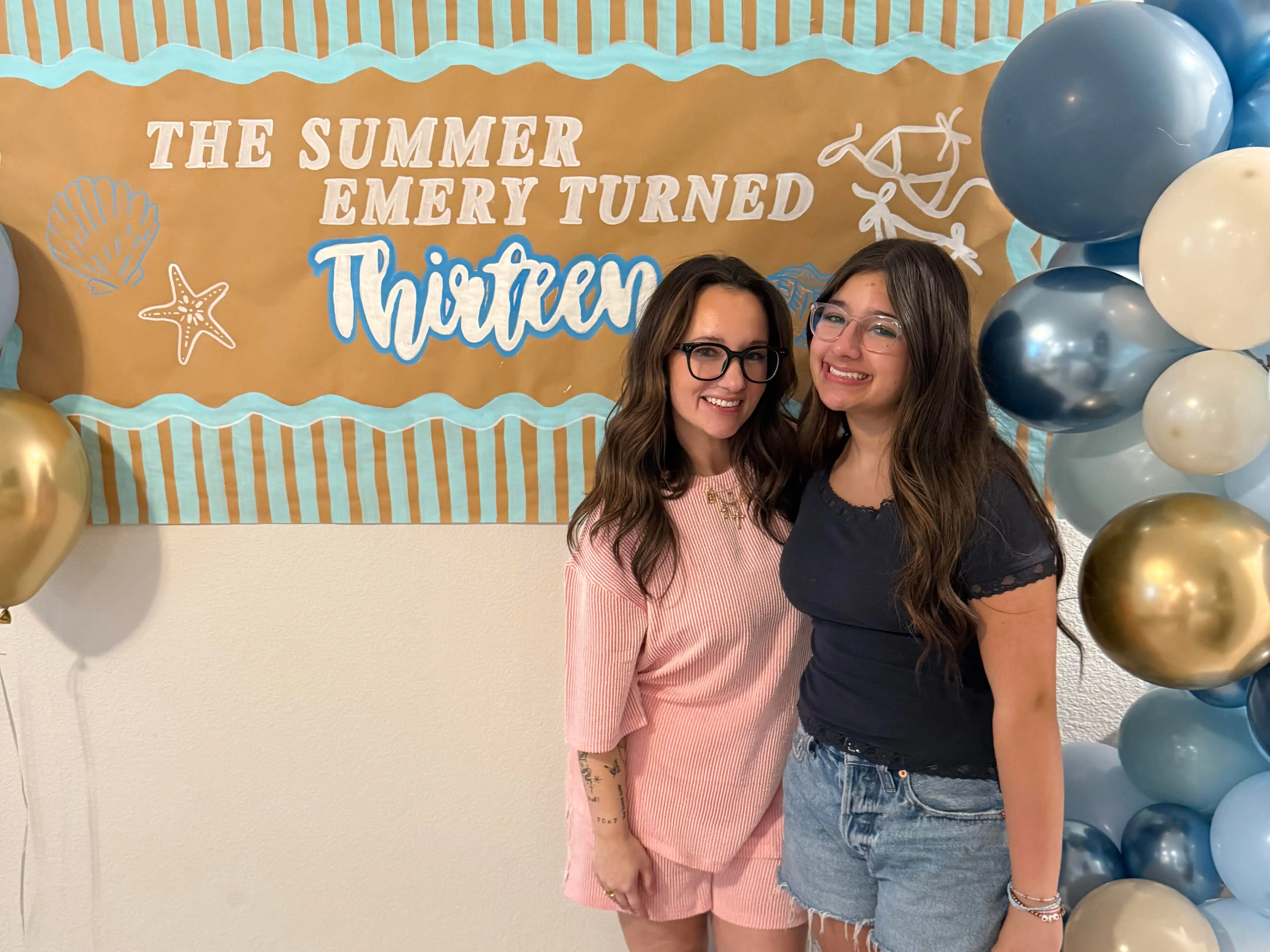 mom and daughter posing for a photo