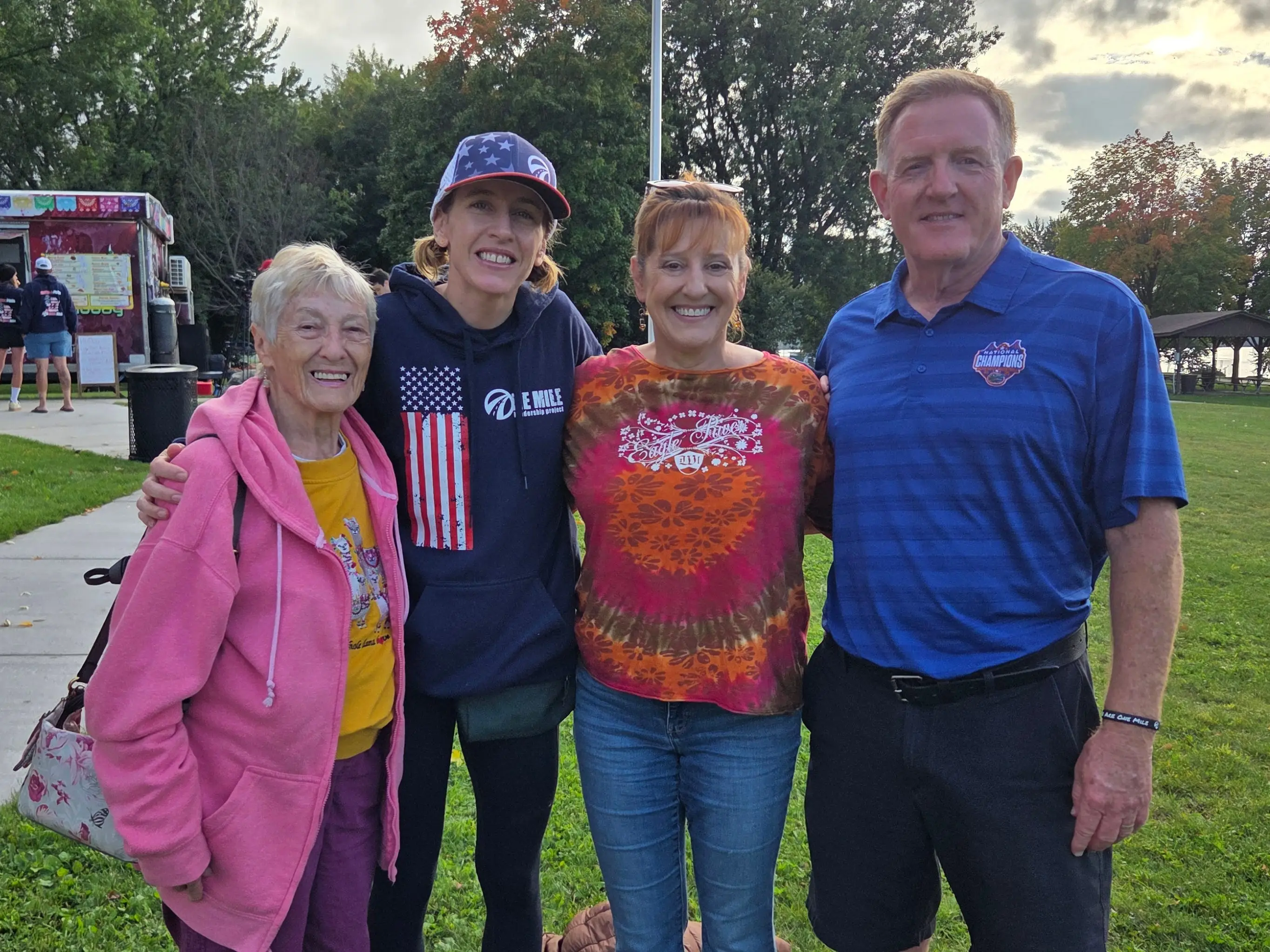 The writer, her husband, and her 90-year-old mother posing with another family member while traveling to Wisconsin.