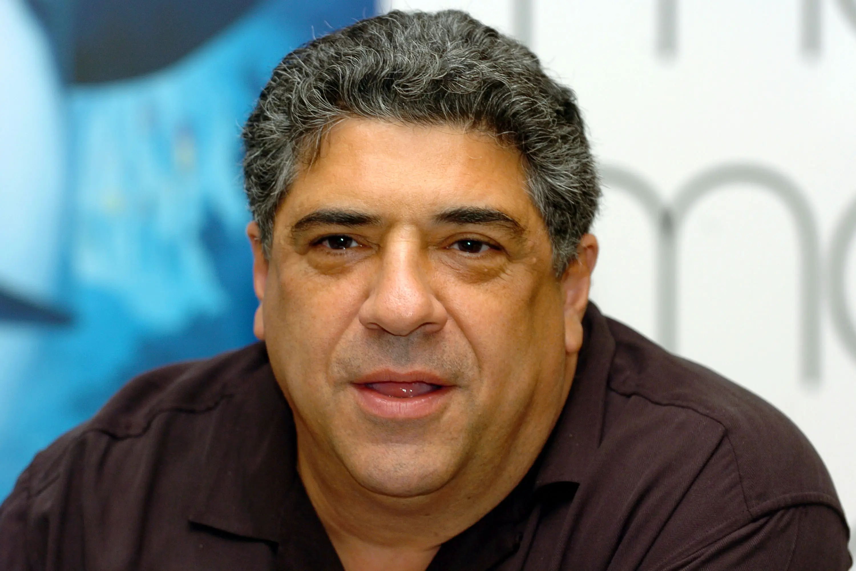 Vincent Pastore wearing a burgundy shirt