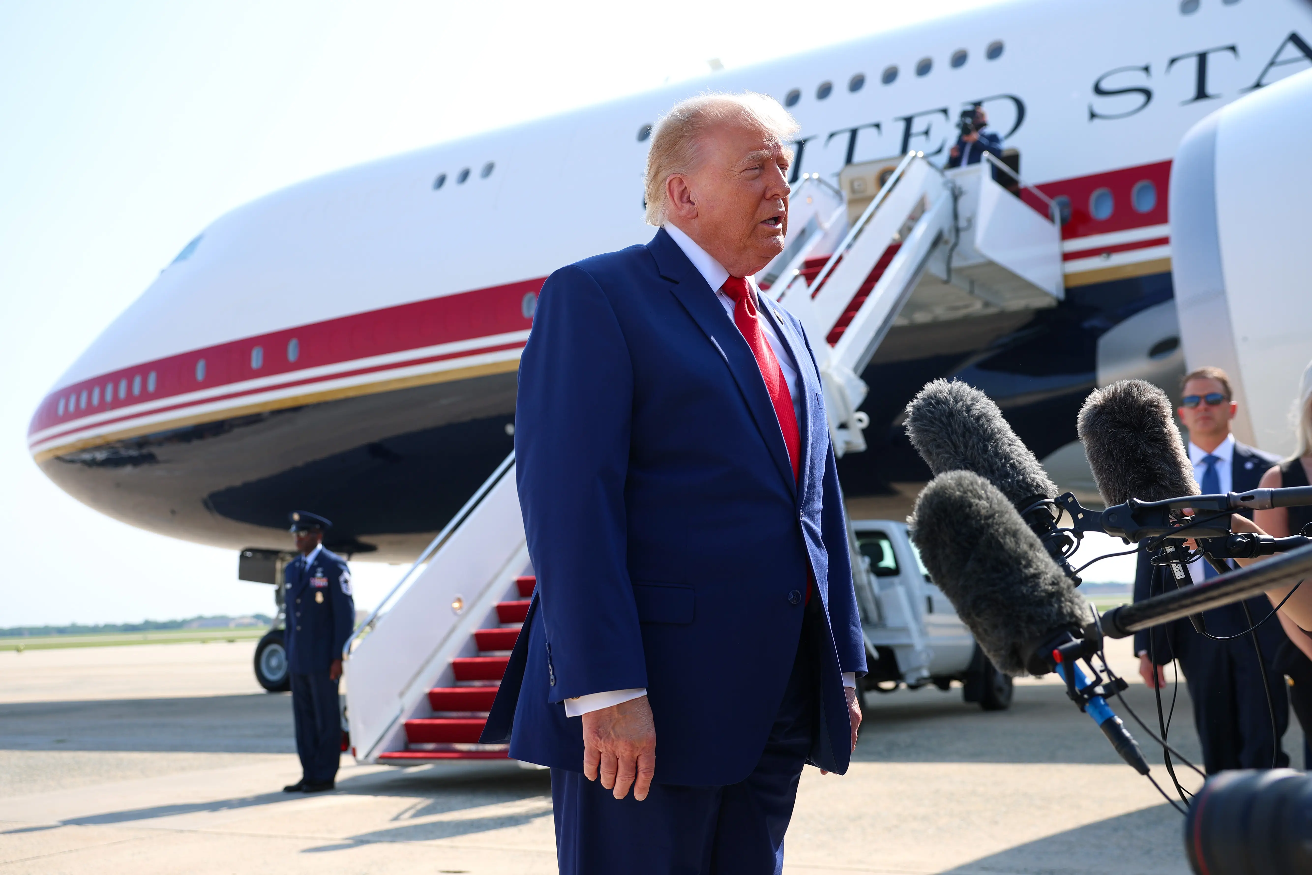Donald Trump speaks to reporters before boarding Air Force One.