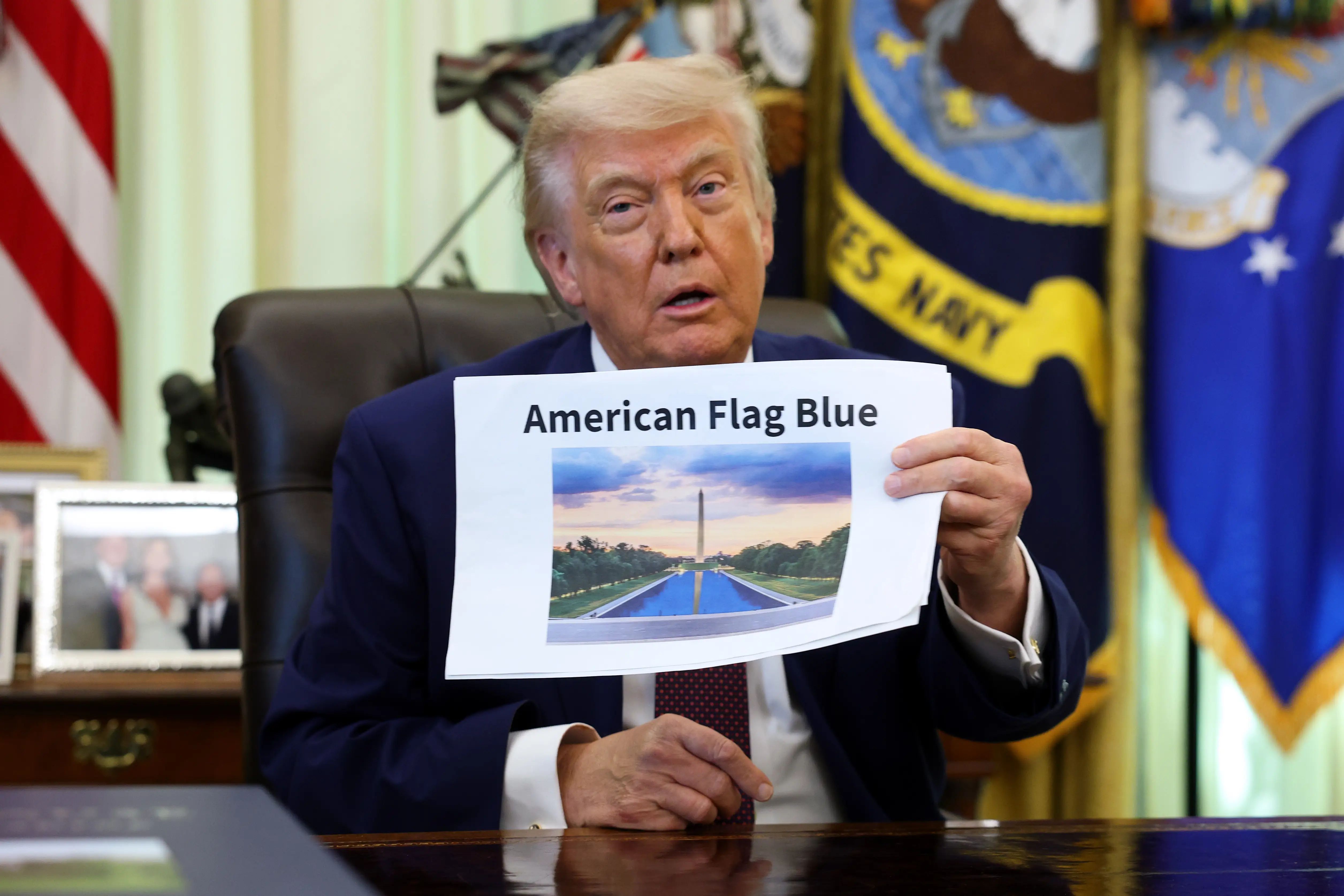 U.S. President Donald Trump displays a rendering of his proposed renovations to the Lincoln Memorial Reflecting Pool during an event in the Oval Office of the White House on June 03, 2026 in Washington, DC.