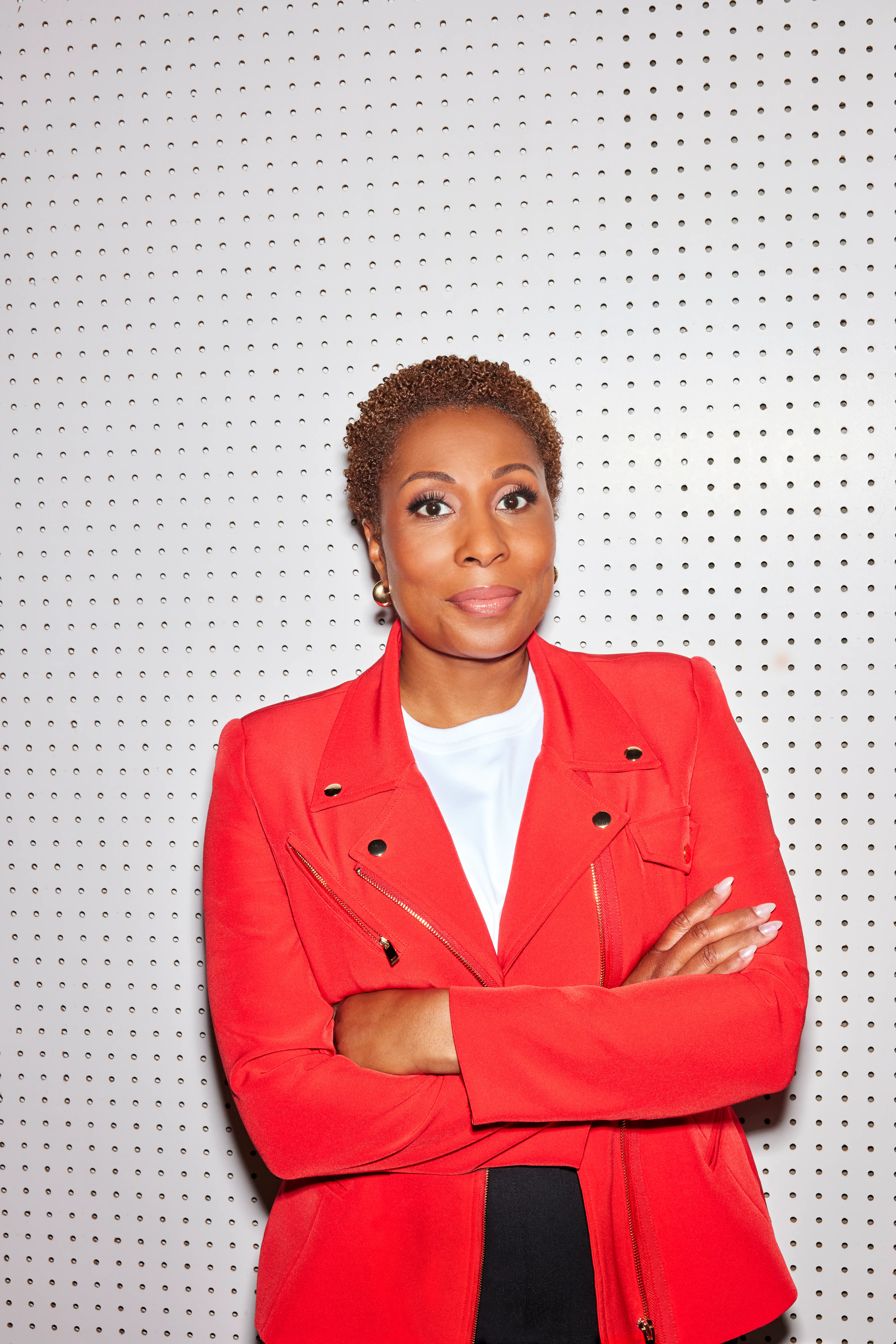 headshot of Audie Cornish in a red jacket
