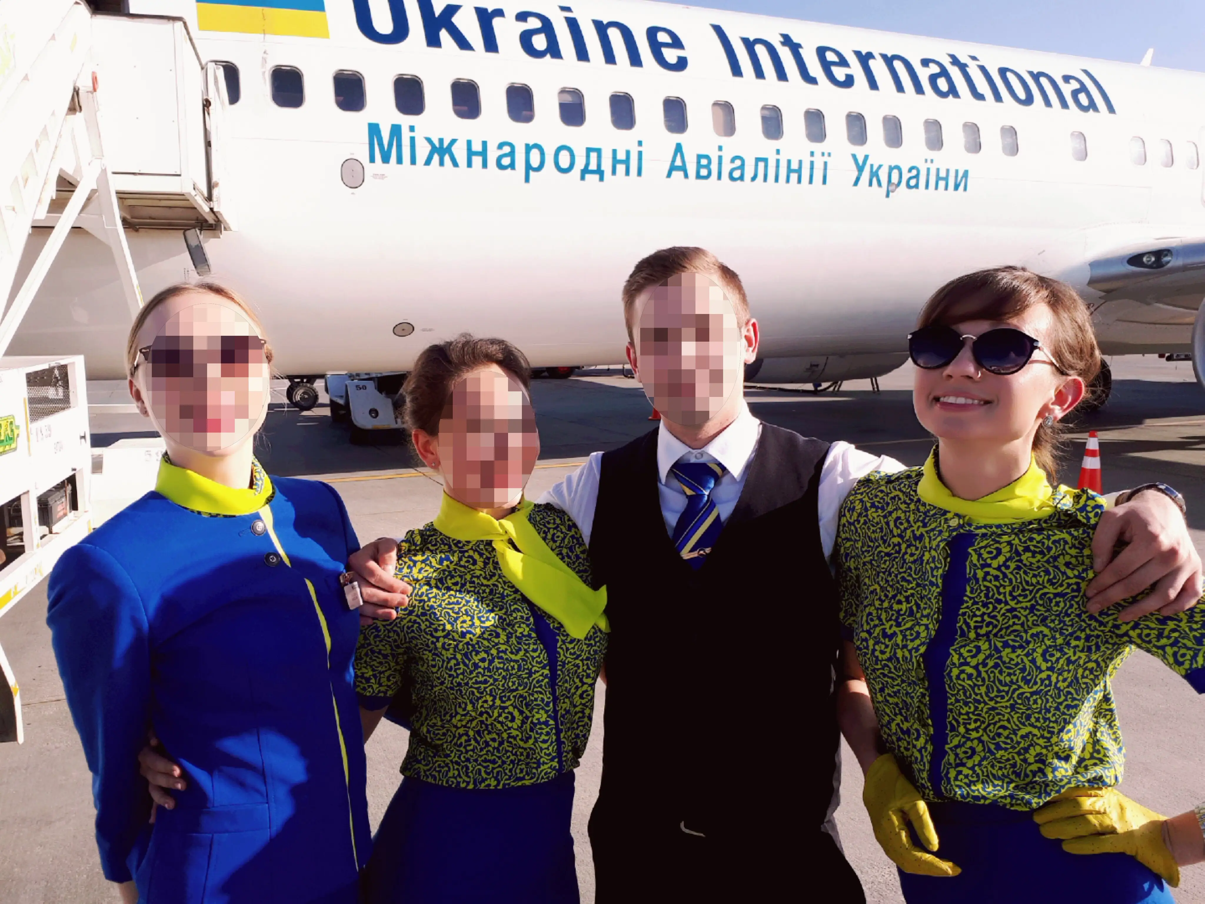 Author with her colleagues in front of a ukrainian airlines plane
