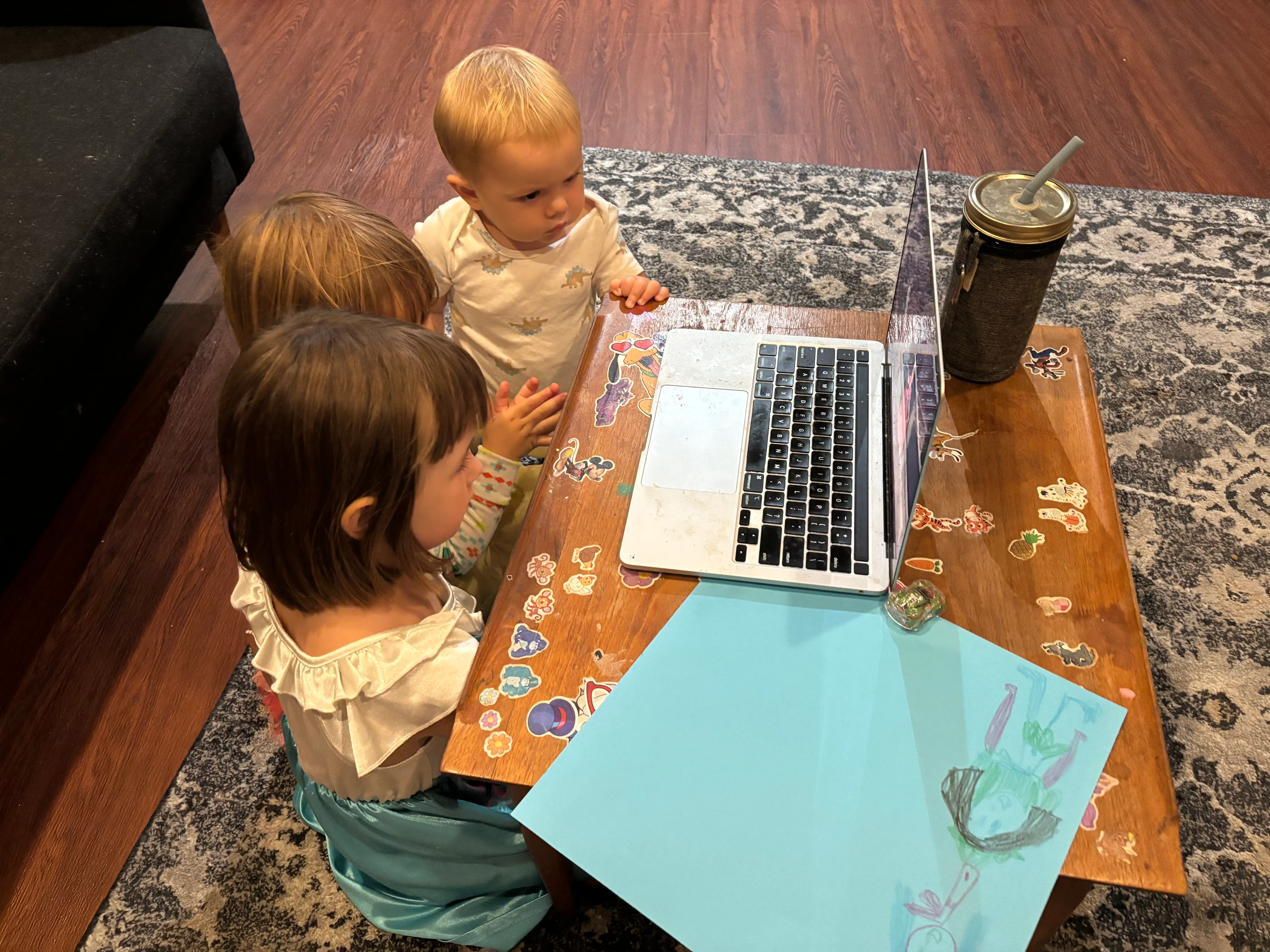 the author's kids watching tv on her laptop